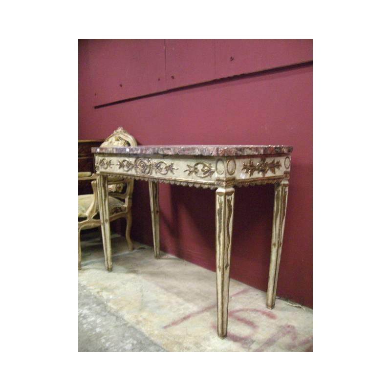 Imposing 18th century Italian neoclassical parcel gilt and beige painted console.
The original and beautiful thick rectangular marble top over parcel gilt and beige painted frieze with foliage motif, resting on four square tapered legs.