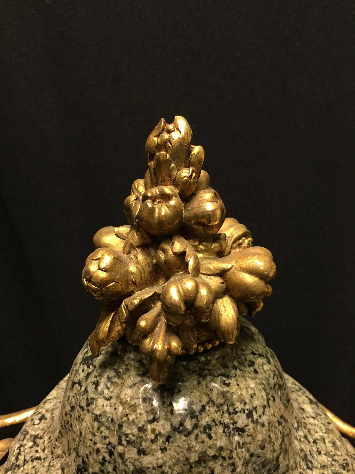 Beautiful pair of Italian neoclassical style ormolu-mounted spiral green marble urns with gilt bronze masks and fruiting finial. 

 