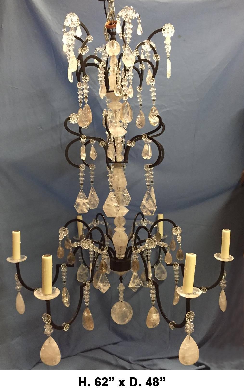 Attractive neoclassical style hand-forged wrought iron dressed with hand-carved and polished rock crystal and smokey rock crystal six-light chandelier.
Antique black patina.
Handmade bees wax candle sleeves.
4 foot chain and canopy included.
 