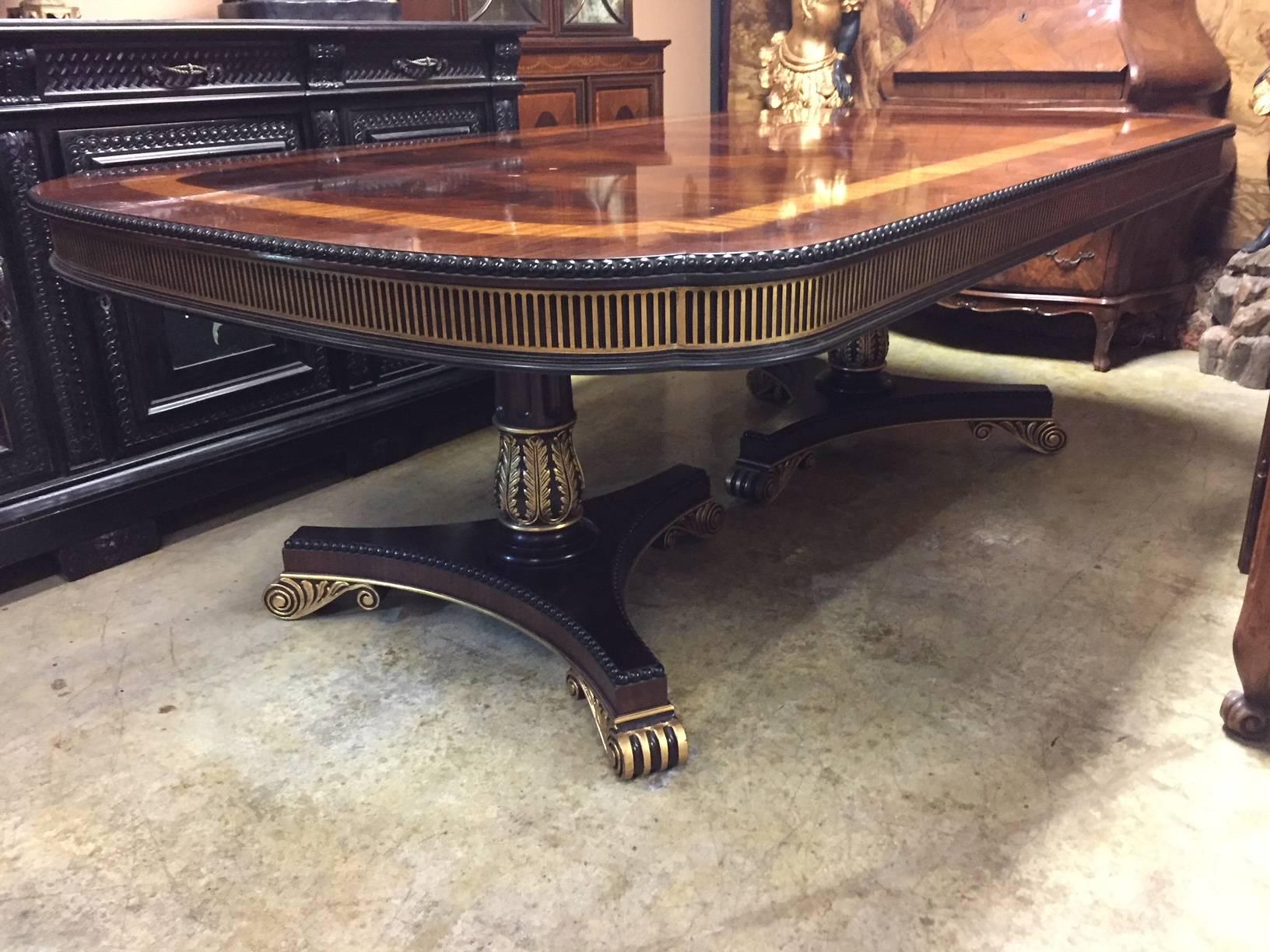 Spectacular regency style carved and partial gilt satinwood and kingwood inlaid mahogany two pedestal dining table with three leaves.
By E.J. Victor.
  

Dimensions:
Height 31 inches x depth 54 inches
Length closed is 89 inches
Length open is 158