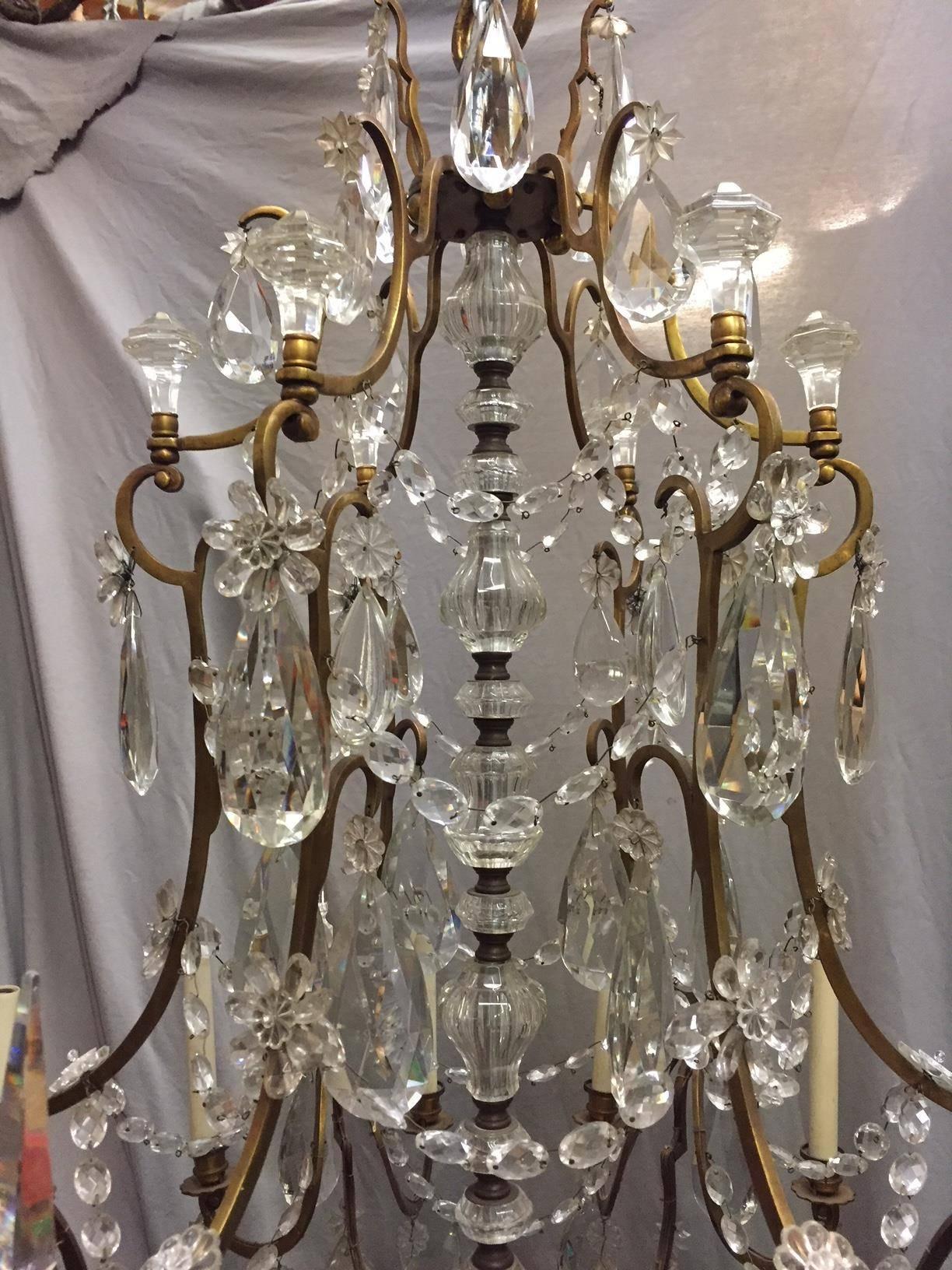 Impressive 19th century French Baccarat style finely cut crystal and bronze eighteen-light chandelier with unique cut crystal centre shaft.
 