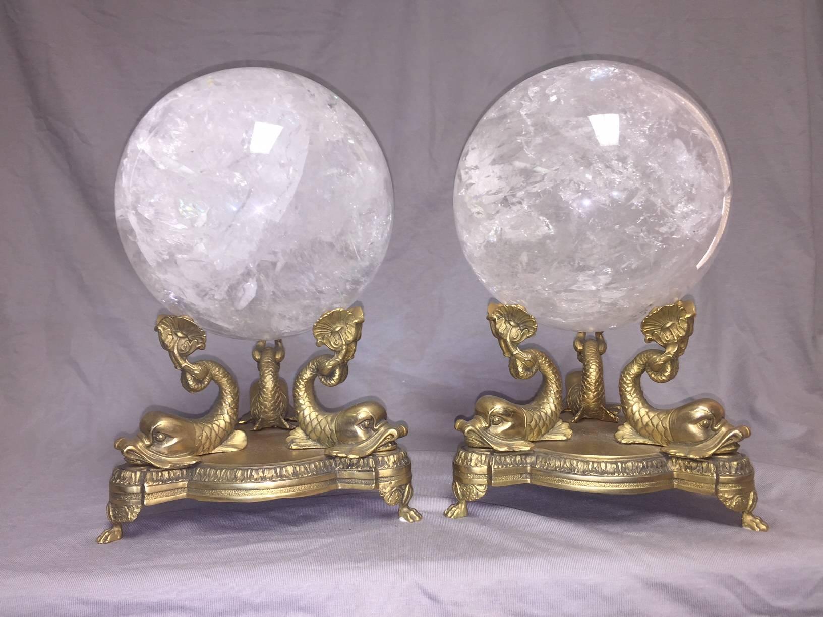Impressive pair of hand-carved and hand polished rock crystal spheres on bronze dolphin bases, second half of 20th century.

The diameter of the rock crystal sphere is 7.5 inches.
The overall height is listed below.

Rock crystal (crystal