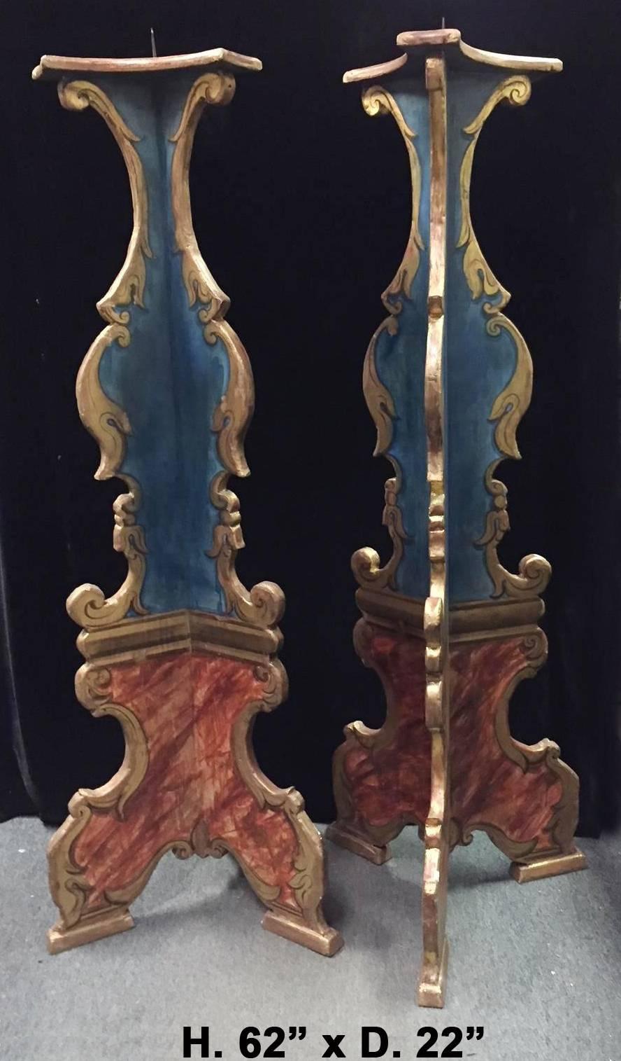 Attractive pair of Italian Baroque style hand-painted torchers outlined with gold trimming in the form of scrolls and foliage, all resting on tripod pricket feet. Mid-20th century.

 