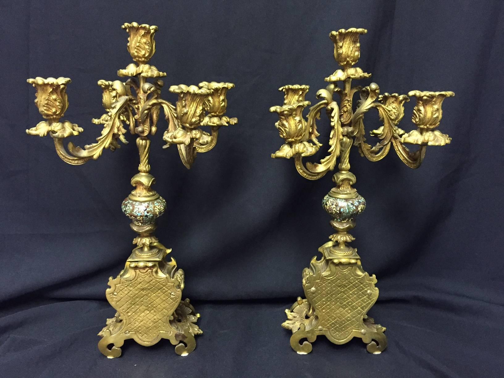 19th century French pair of Rococo style ormolu and champlevé candelabra with five scrolling acanthus leaf lights on bronze and champlevé enamel Rocaille base.

The measurement for the base is: Width 6.5 inches x depth 4 inches.