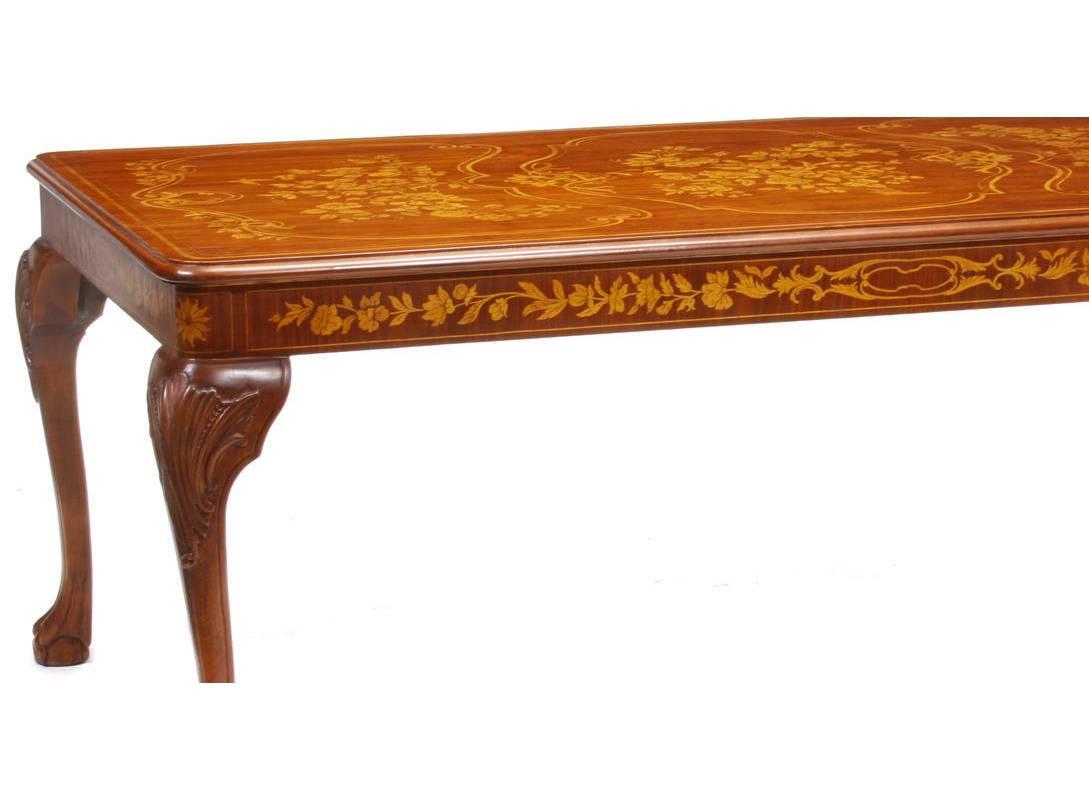 Unusual Dutch marquetry style fruitwood dining table with floral motif, late 20th century. The rectangular top consisting of three beautiful inlaid floral bouquet over marquetry frieze, all on four cabriole legs terminating in ball and claw feet.

