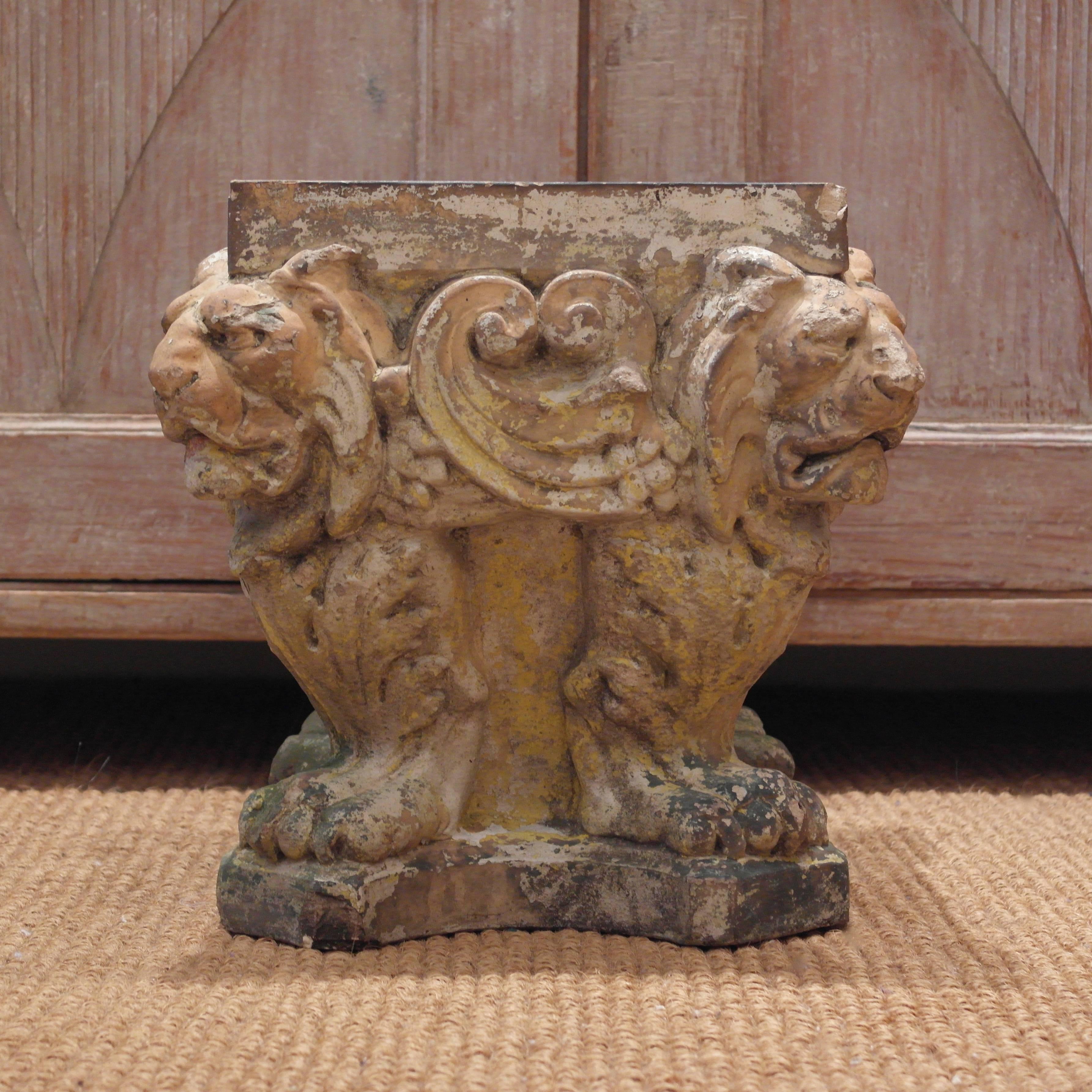 A rare 19th century terracotta Doulton plinth with lovely patination and featuring four cross looking lions - with an incised Doulton Lambeth mark.