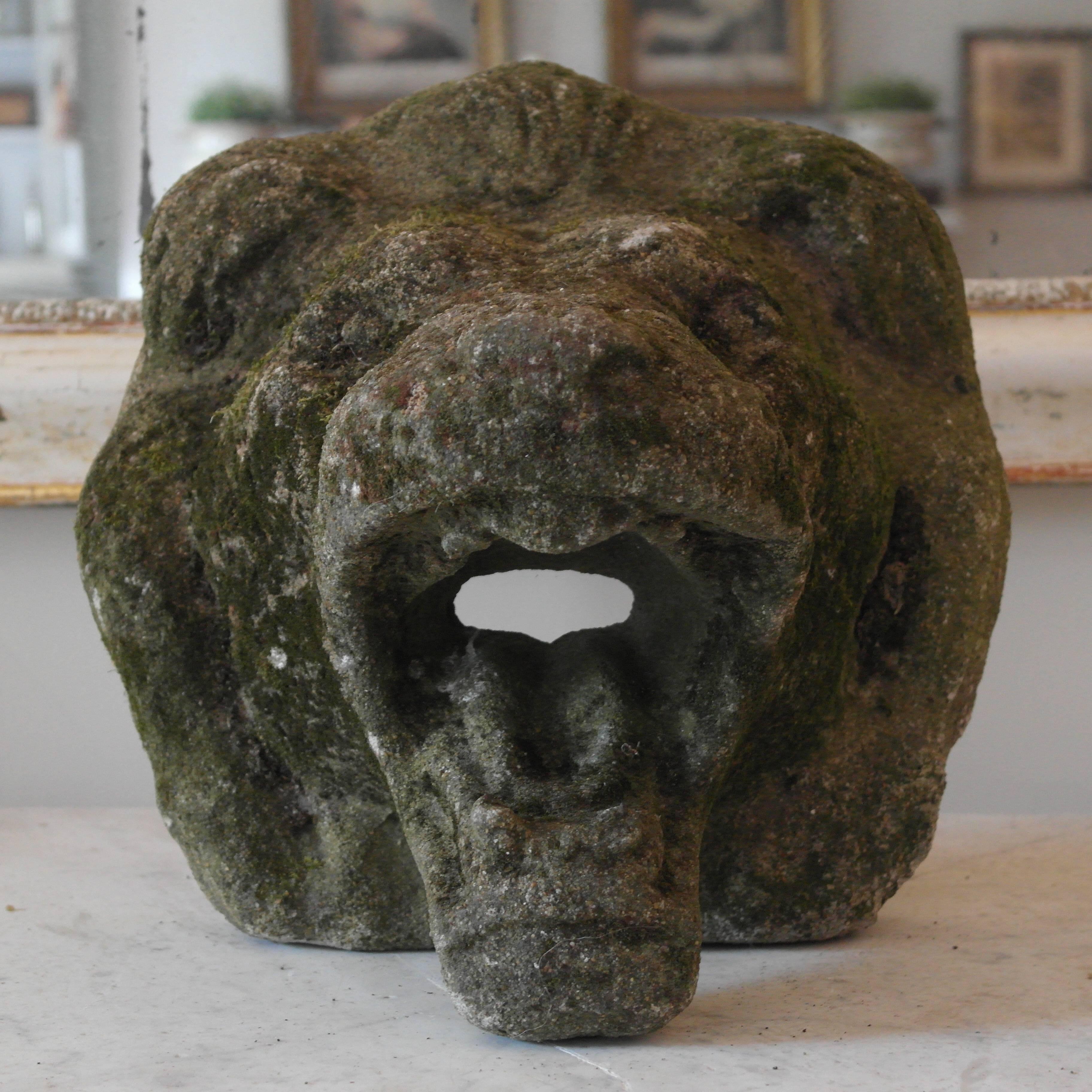 This fabulous and unusual lion’s head was originally designed as a water feature - ideally to put on a wall but because the large chin keeps it upright it could be placed as a decorative feature equally well - with good patination.