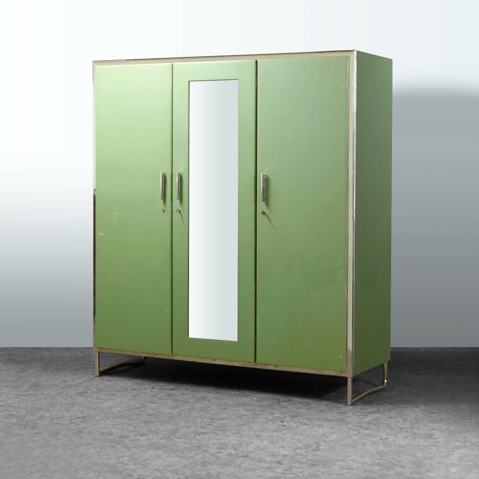 Three-door wardrobe, chrome-plated steel and wood in its original green lacquer, Czech Modernism, circa 1930.
