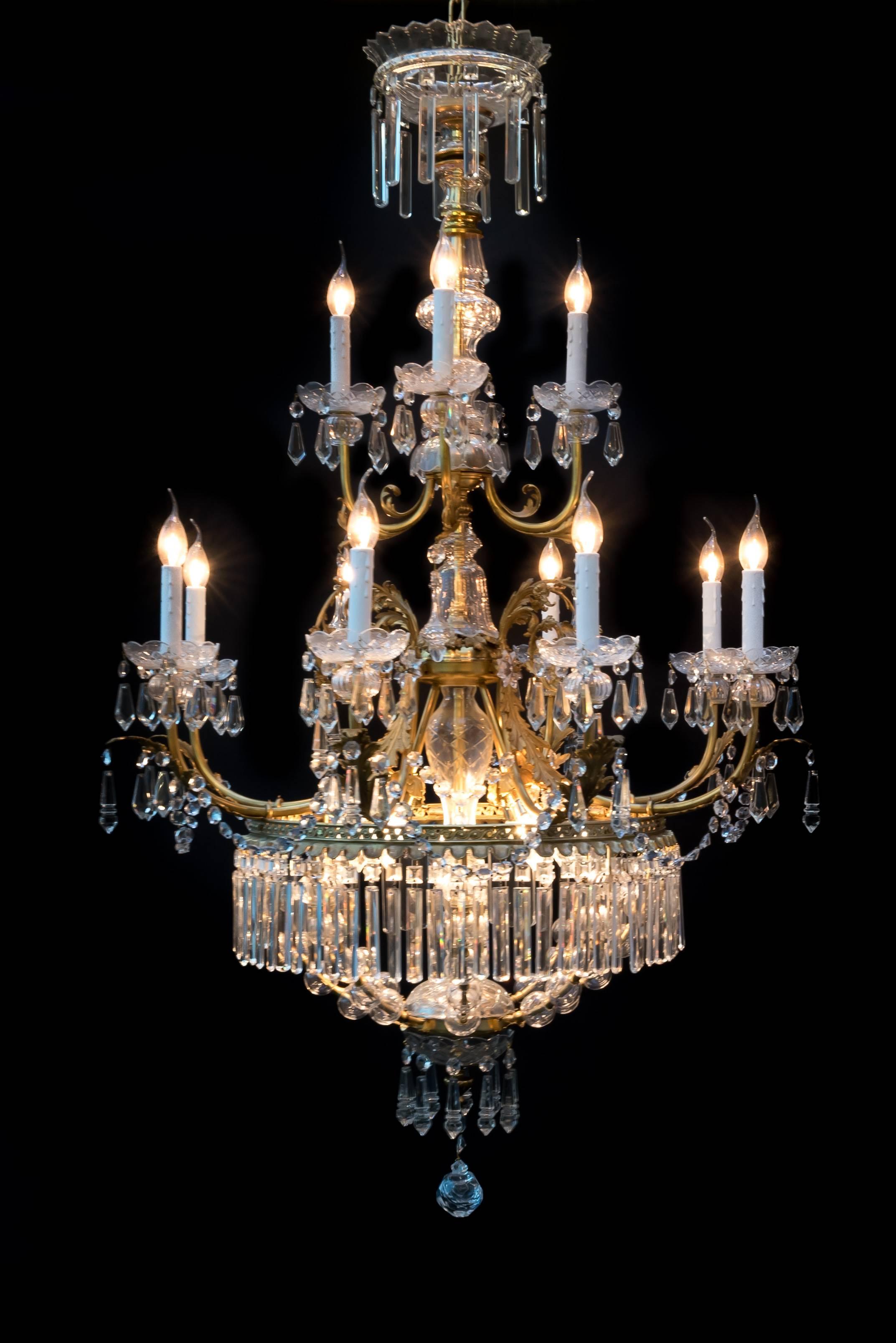 Elegant twelve arms French chandelier in Louis XV style.
Manufactured at the end of 1800.
Magnificent bronze ornament with Rococco style elements performed with very fine cut crystal with unique crystal ball.
Rare model.