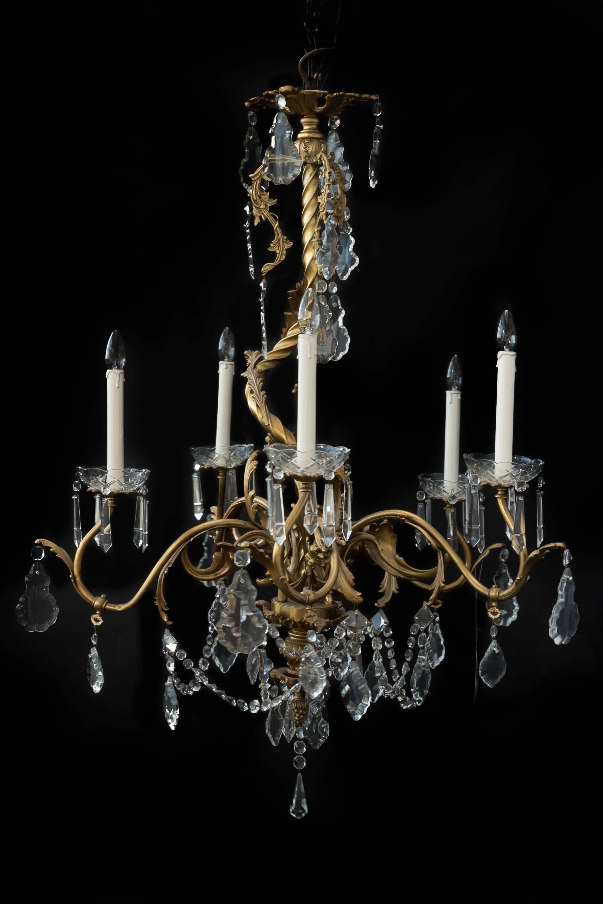 This five lights chandelier was made in Paris, circa 1860 in cast bronze.
The large sparkling crystal parts are hand polished.
Originally intended for gaslight and later converted to electricity.
Rare and unique chandelier.