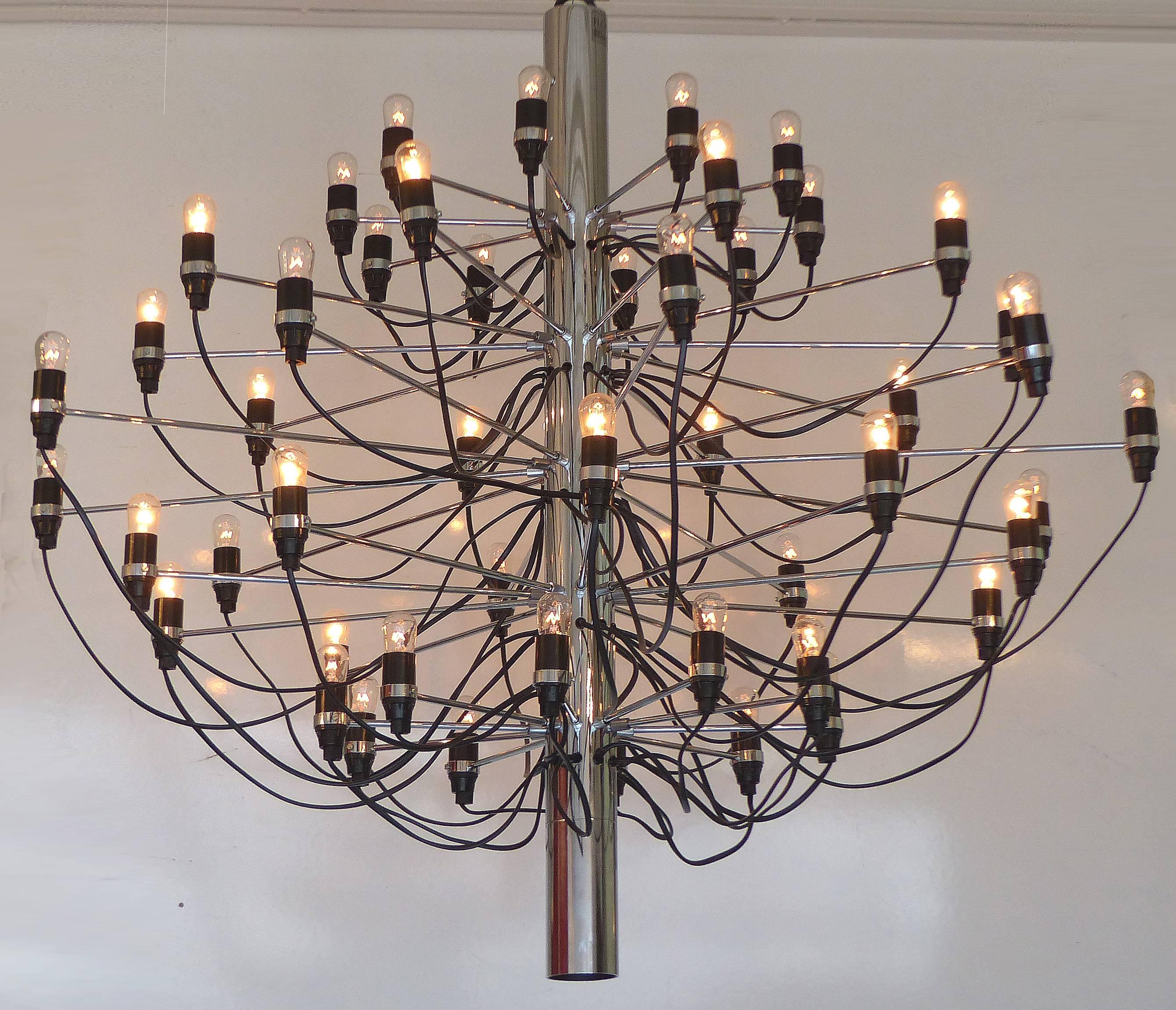 A timeless Mid-Century Modern 50 light Gino Sarfatti Model number 2097/50 chandelier, originally designed by Sarfatti in 1958 in tubular chrome for Flos of Italy. Flos purchased Arteluce, the company originally founded by Gino Sarfatti in 1939. The