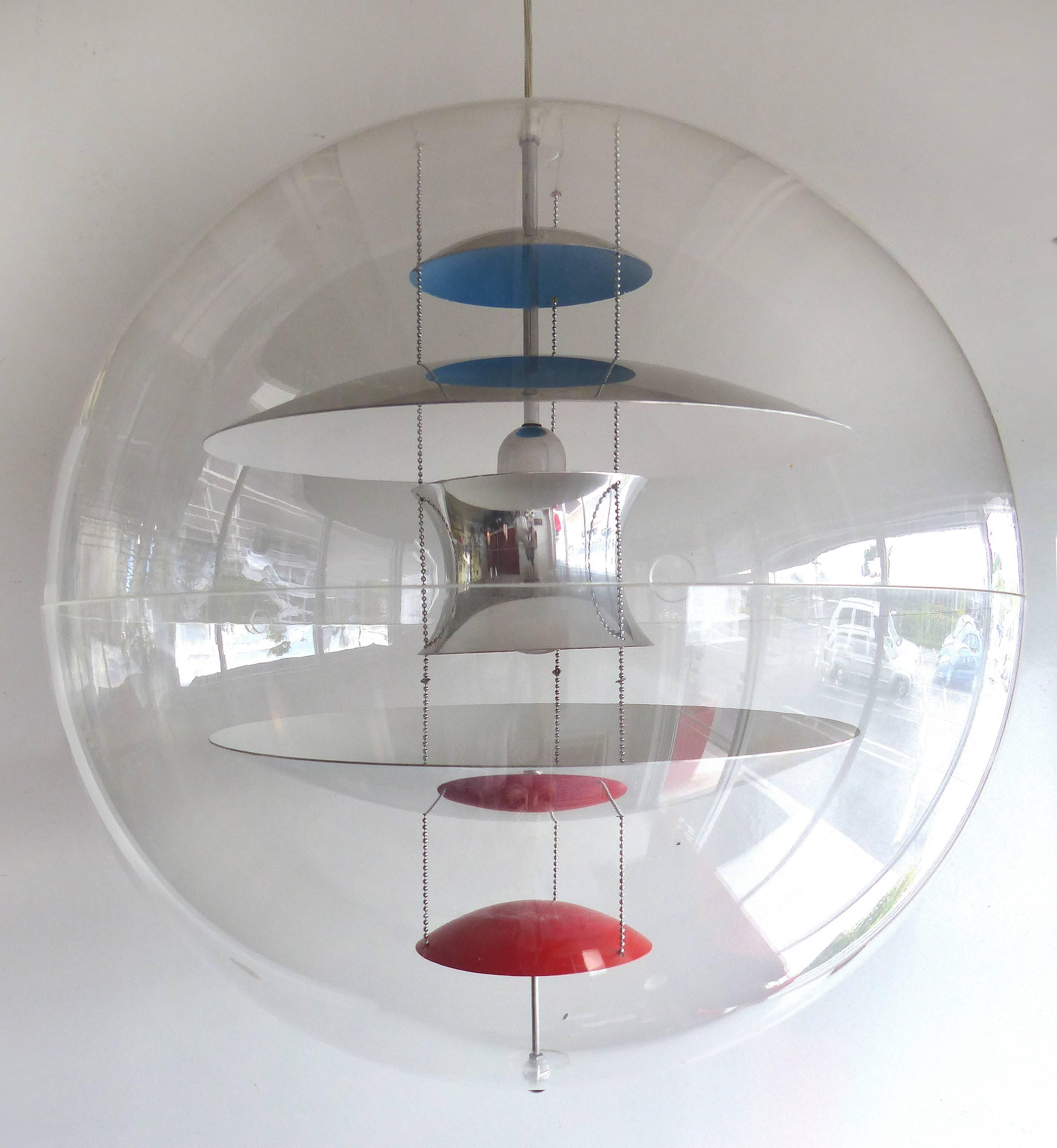 The VP globe light was designed by Verner Panton in 1960s for Louis Poulsen in Denmark. This suspension mounted incandescent light is composed of five reflectors in aluminum screens with a lacquered colored finishes. These reflectors are encased