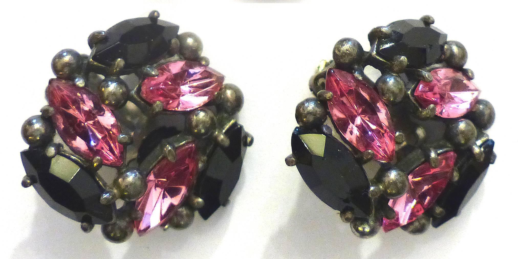 1950s Elsa Schiaparelli Rhinestone Brooch and Earring Set

A 1950s Elsa Schiaparelli brooch and earring set with pink and black rhinestones. Schiaparelli worked alongside coco channel and was responsible for some of the greatest creations of the