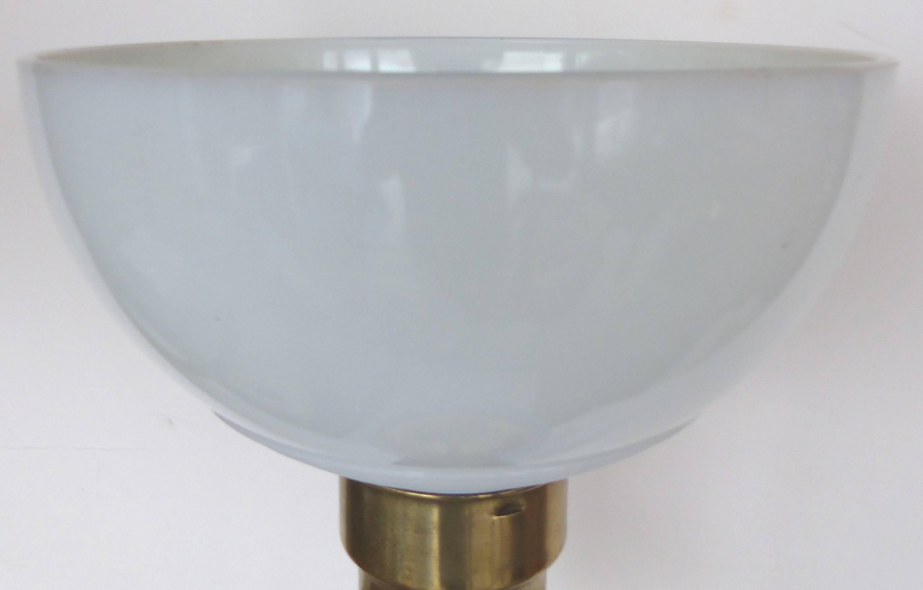 Mid-Century Modern Blue Murano Glass Table Lamp by Marbro

A large Mid-Century Murano glass table lamp by Marbro Lamp Co. supported by an ebonized wood base with brass fittings. The diffuser shade is provided and support a shade above. Retains the