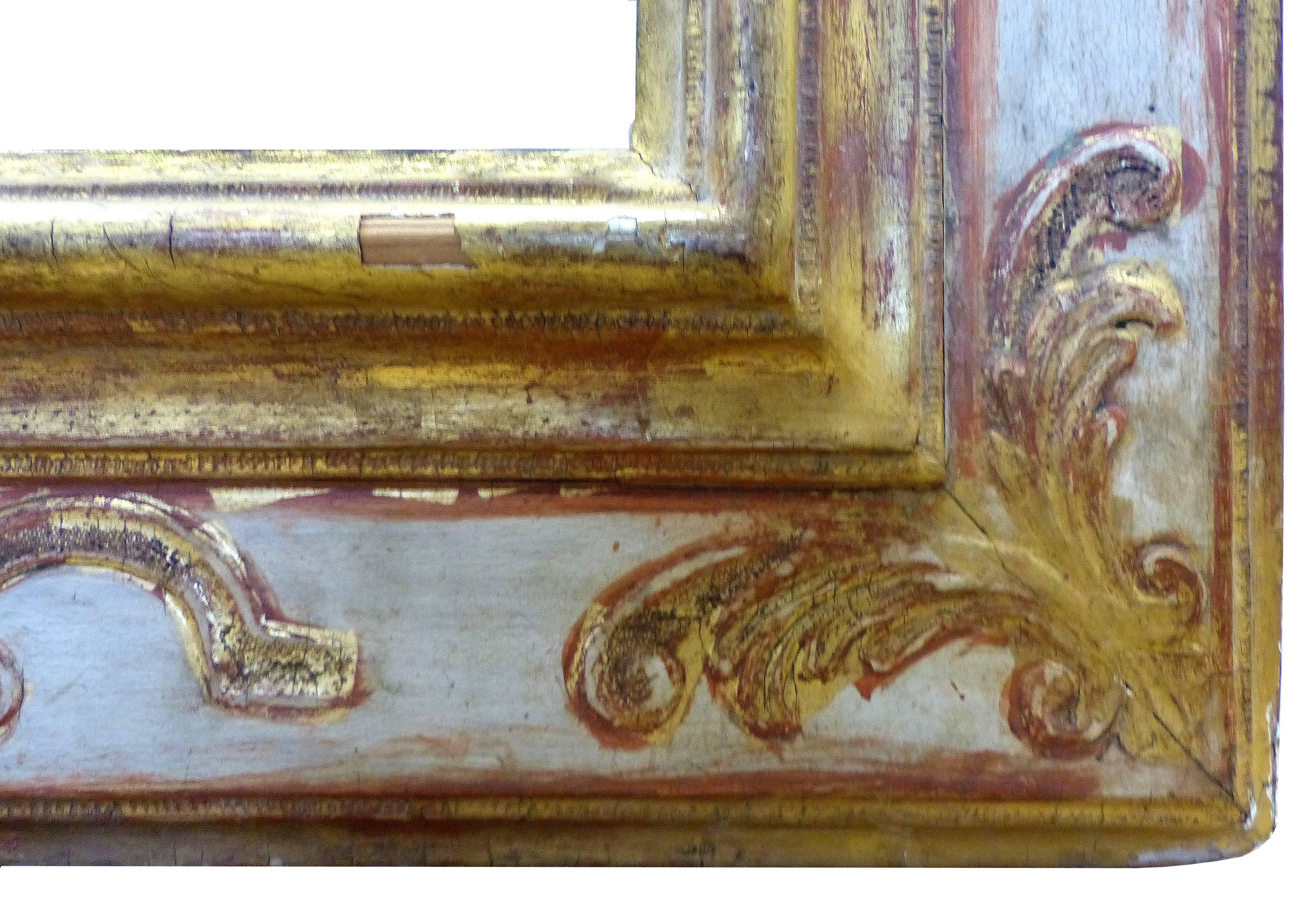 An elegant European 17th century carved giltwood frame from either Spain or Italy. Has achieved an appropriate patina with finish and edge wear commensurate with age. Inside dimensions, 33" x 41"; viewed either vertically or horizontally.