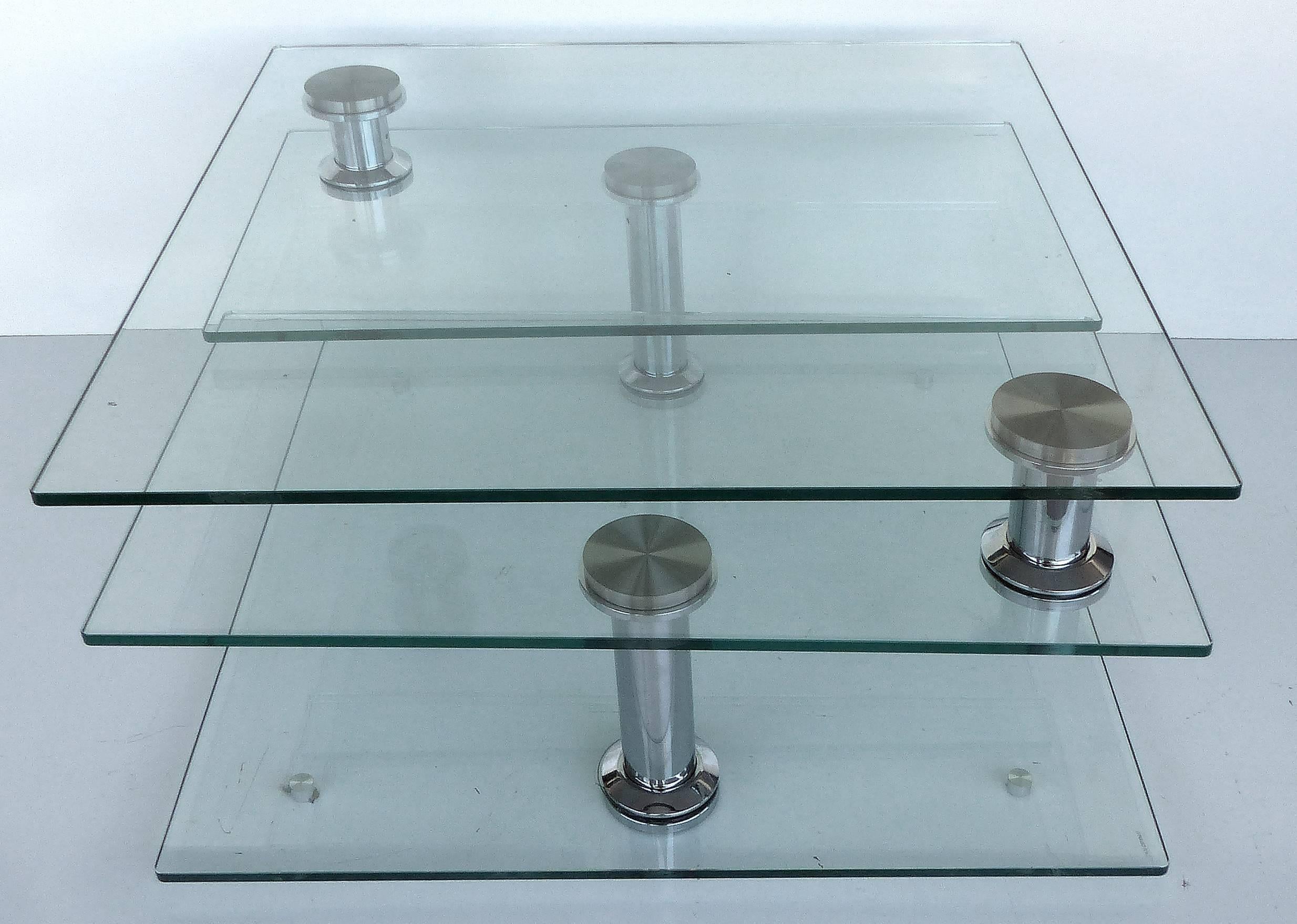 A versatile Mid-Century Modern metamorphic tempered glass and chrome square coffee table. A rare model which rotates smoothly to create a number of different configurations. Measurements given are in the closed position as seen in the second