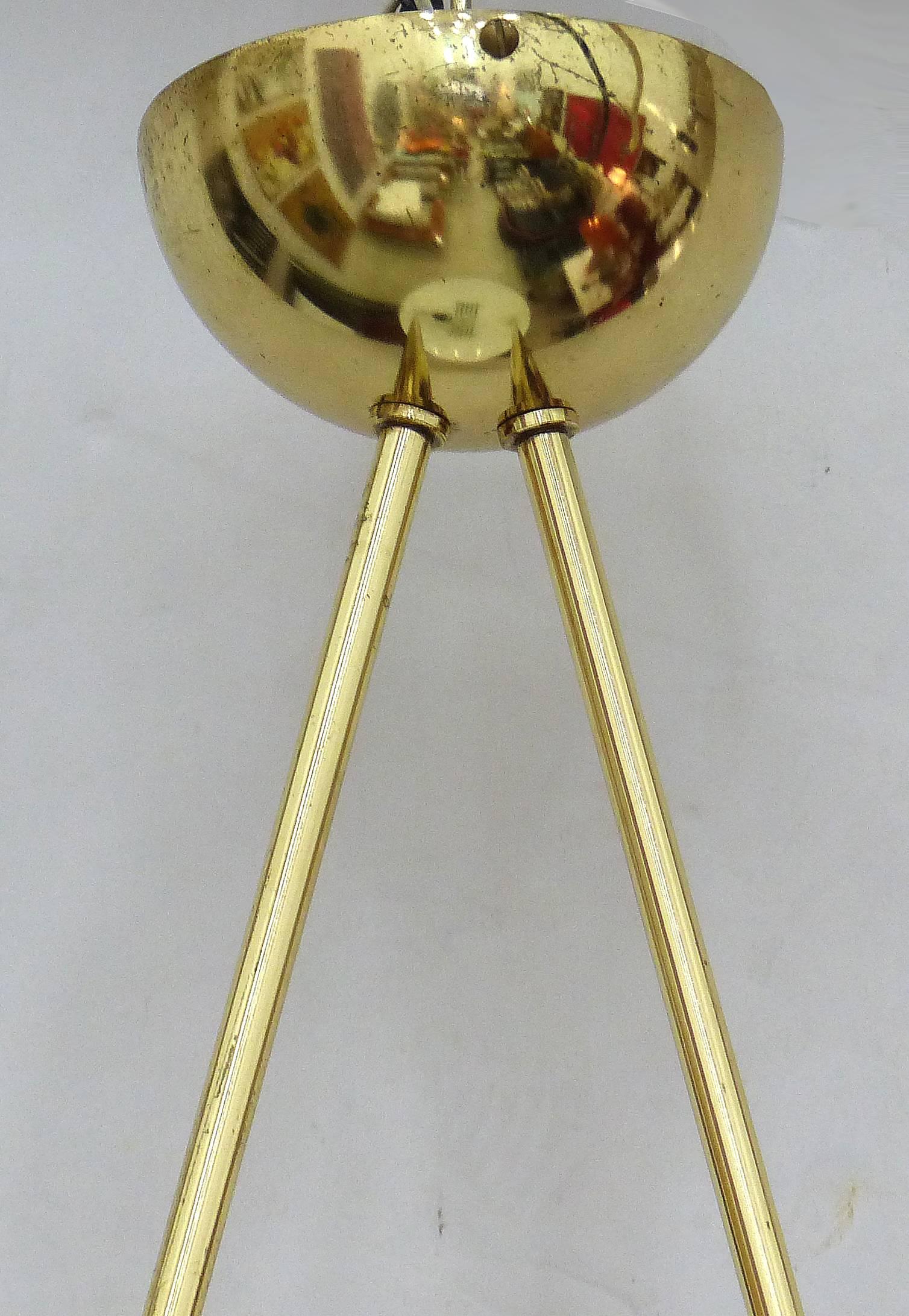 A sleek brass up-light ceiling fixture manufactured in the 1980s in the style of the Italian company Stilnovo. Unusually streamlined with only two brass support rods. The body is brass with five glass discs descending that allow for light to vent