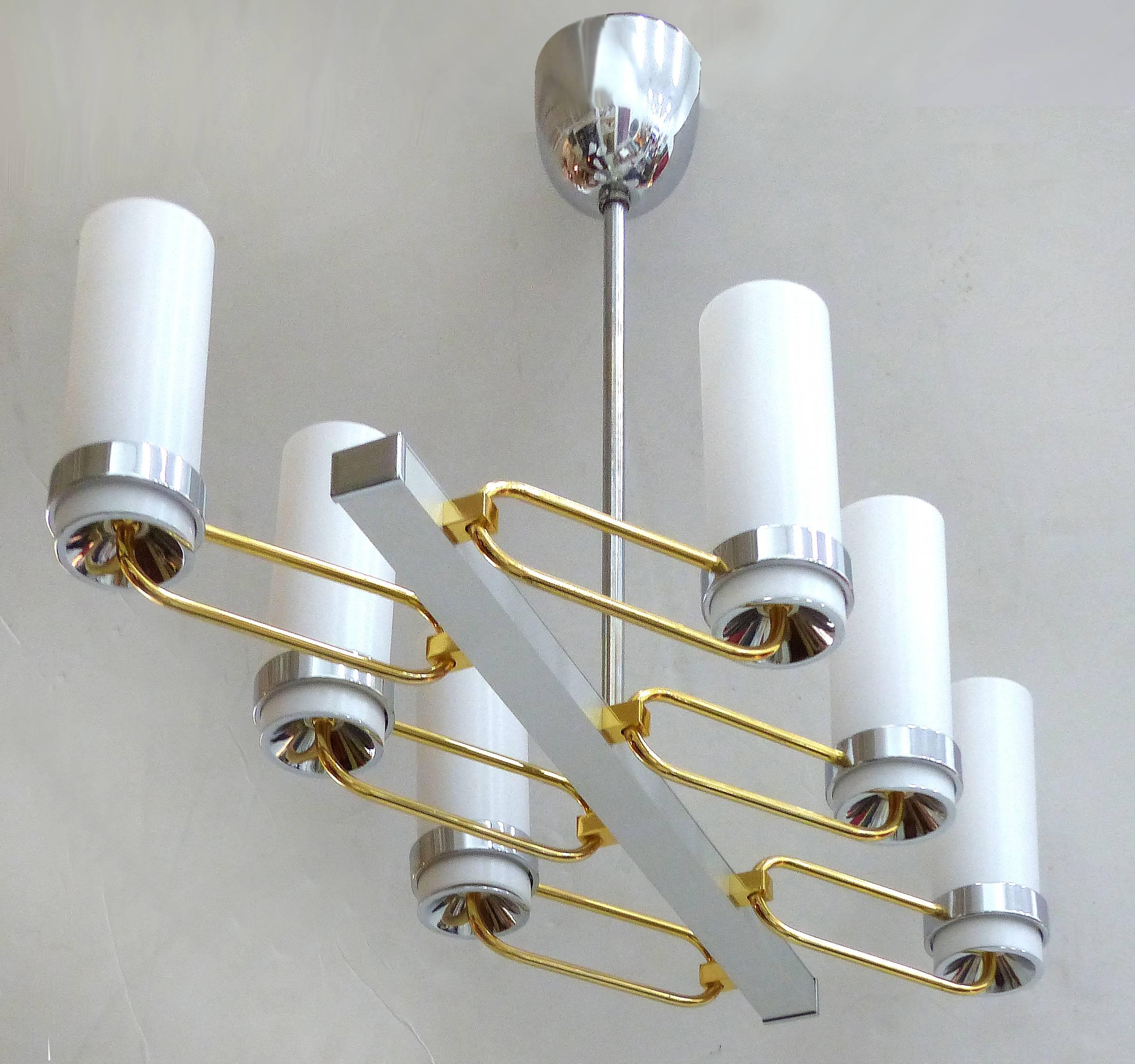 Mid-Century Modern Two-Tone Chandelier with Glass Shades

A very unusual Mid-Century two-tone chandelier with six brass and silver tone angled arms that each support a white glass shade. The fixture contrasts mixed tones of brass, aluminium and