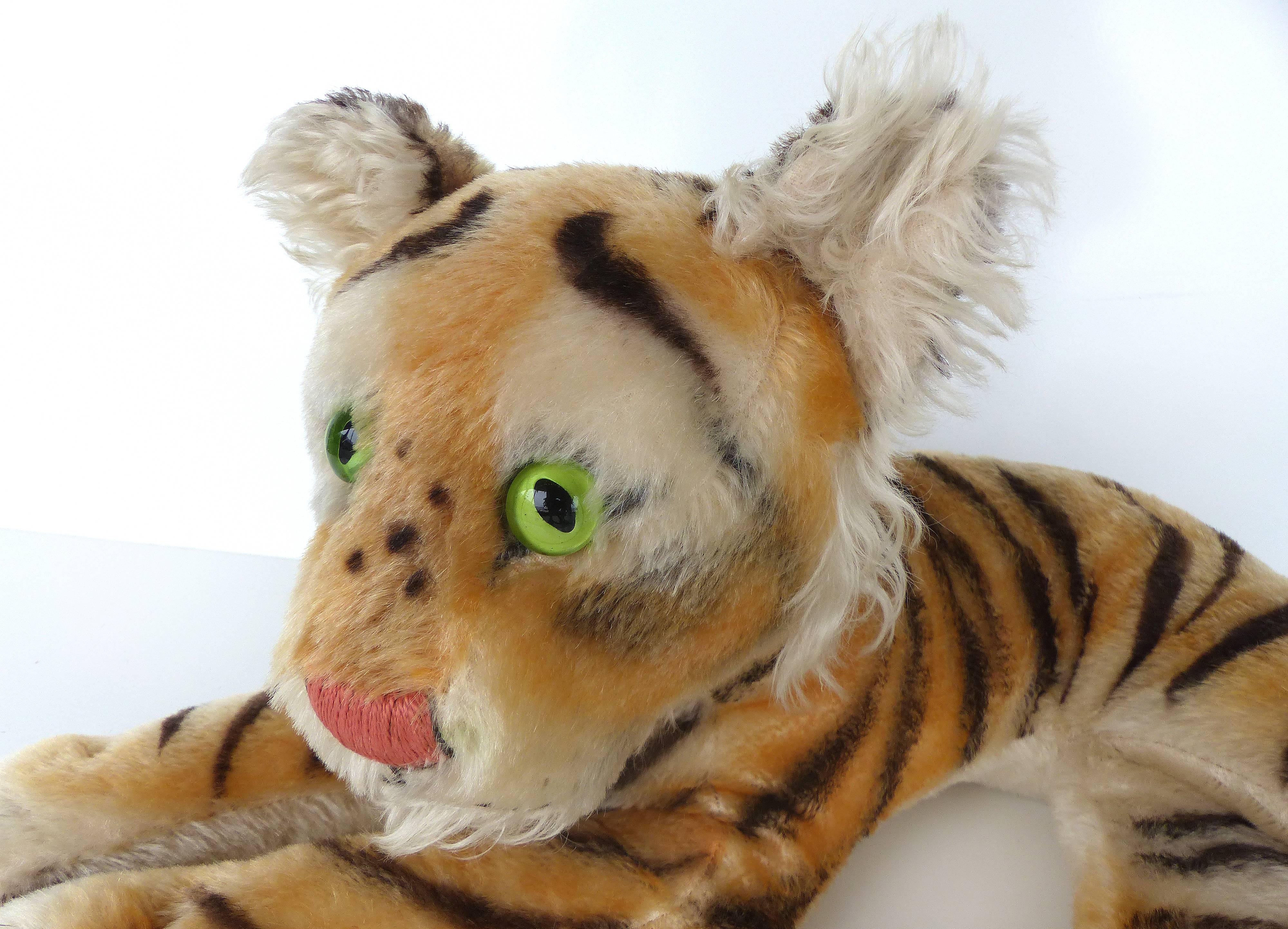 A wonderful gently loved German Steiff Tiger from the 1940s or 1950s that is in excellent vintage condition with good coloring and minimal wear to the mohair.


 