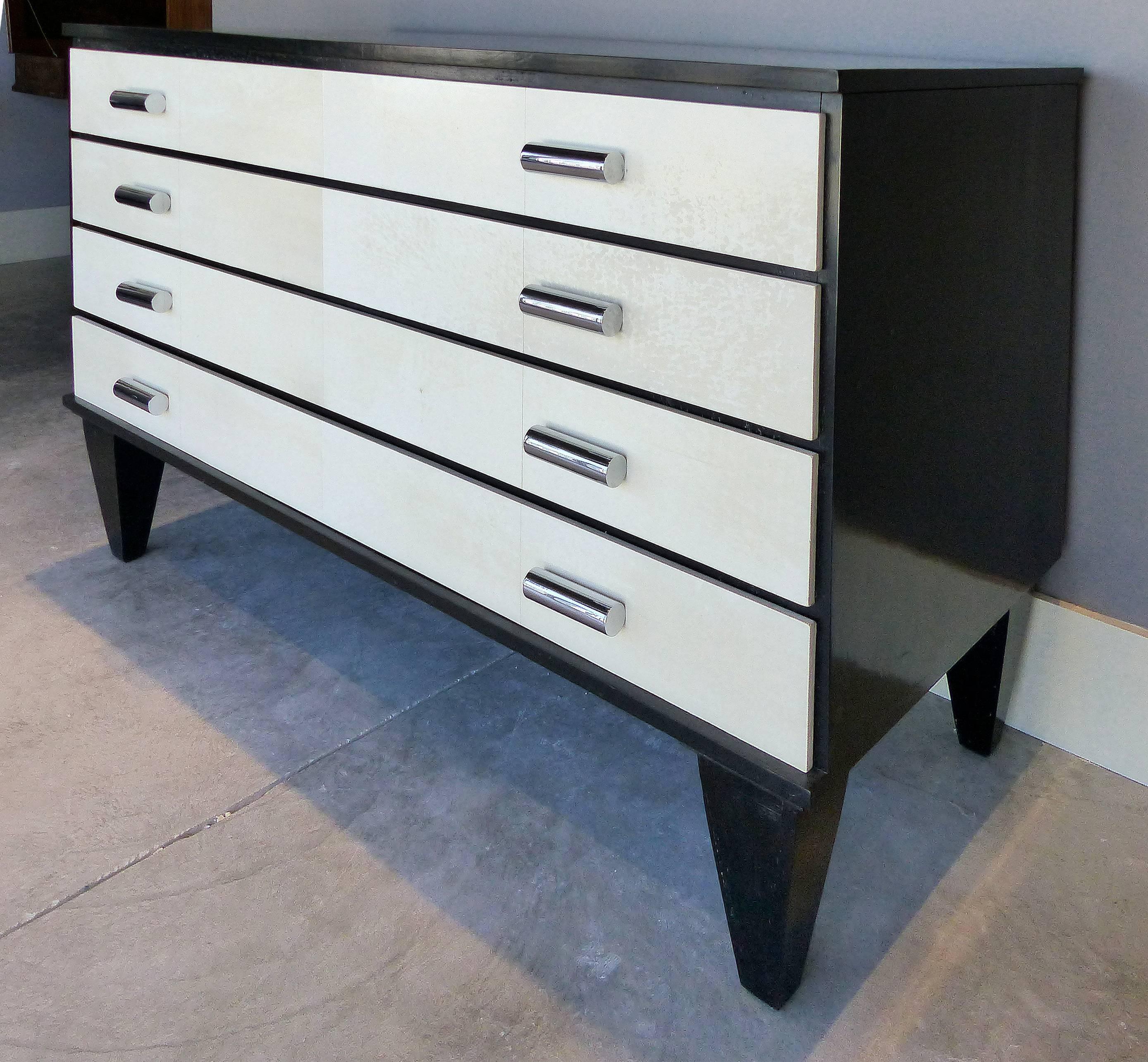 Art Deco Goatskin and Ebonized Mahogany Four-Drawer Dresser

A large and substantial four-drawer dresser with goatskin clad drawers and solid wood construction. Ebonized mahogany finish and stainless steel drawer pulls accent this high quality chest