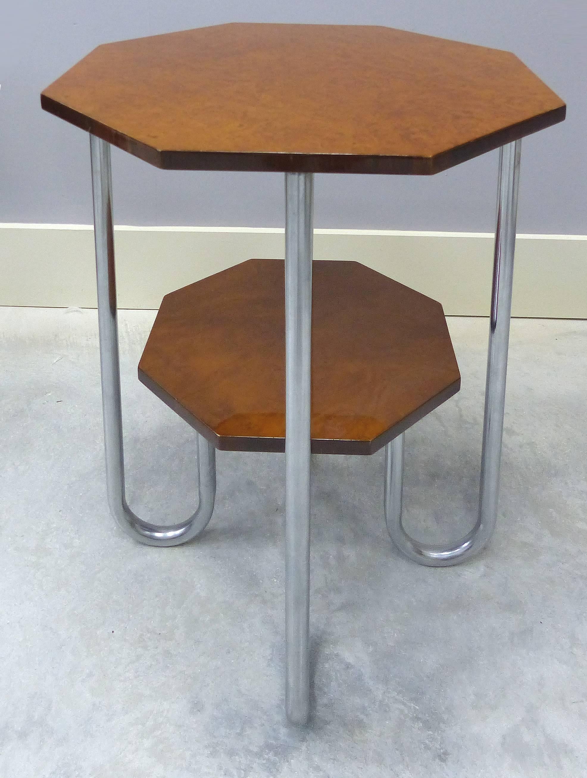 A rare and important pair of Art Deco tables by Andre Lurcat (French, 1894-1970) for Thonet. A two tiered octagonal shape is supported by chrome-plated bent steel tubular legs.