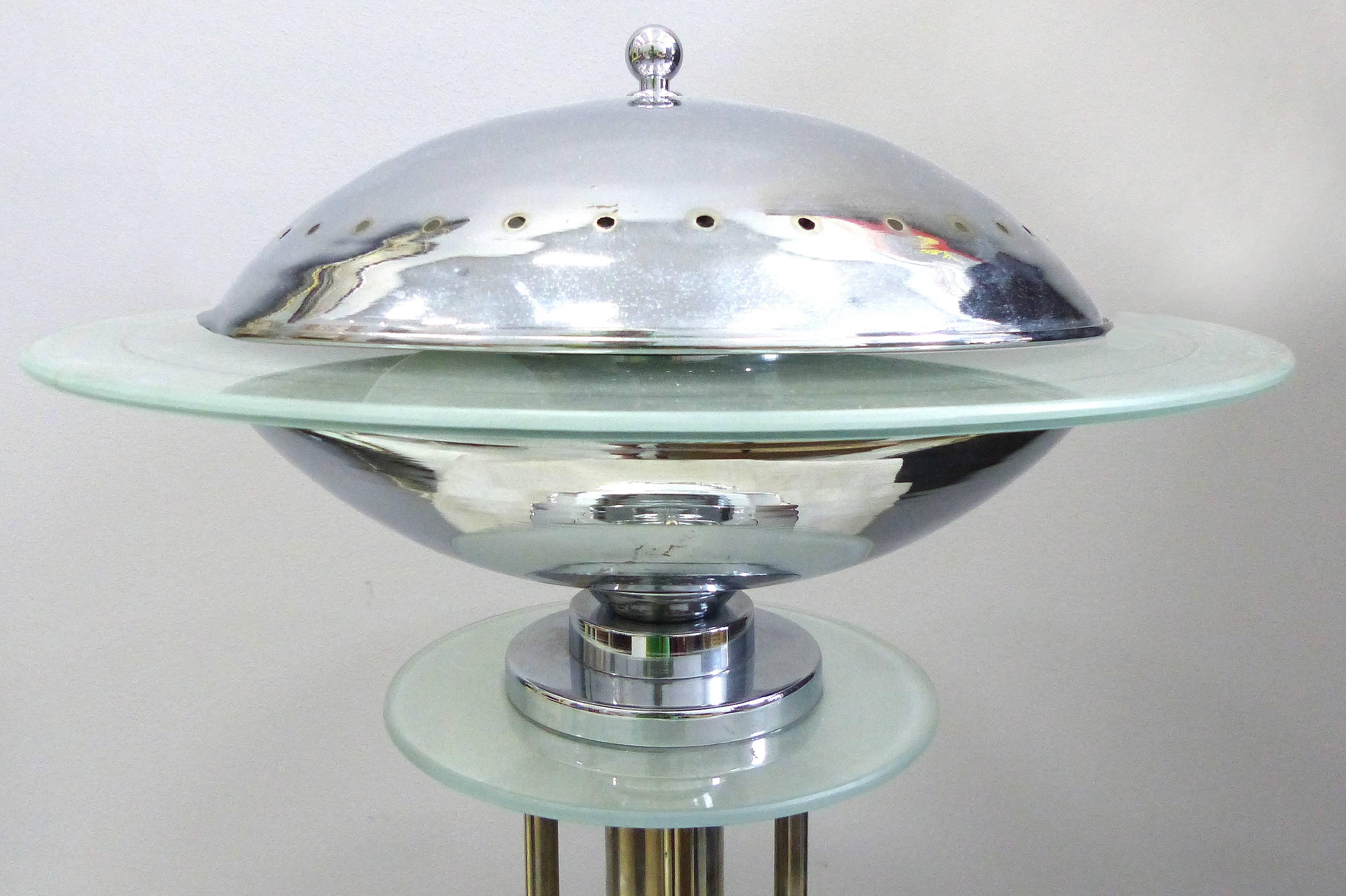 Mid-Century American Art Deco Style Chrome Lamps, Pair

Offered is a pair of American Art Deco style chrome table lamps with etched glass rings that illuminate with the look of a flying sauce. These lamps are mood lights with additional beams