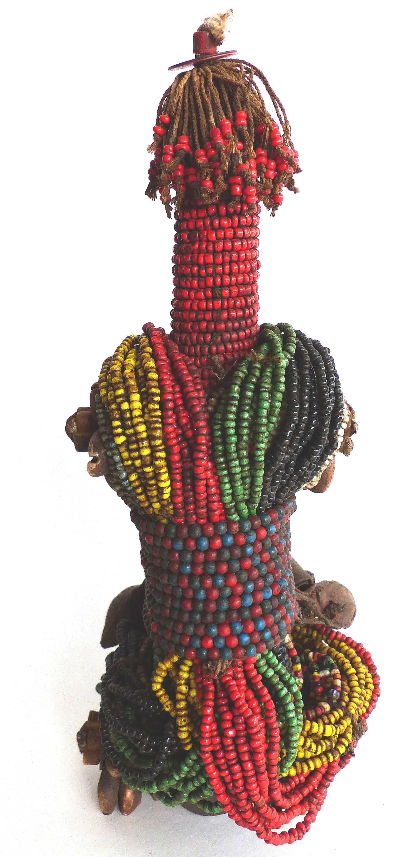 20th Century African Beaded Fali Fertility Doll from Cameroon

Offered is a beaded Mid-20th Century African Fali fertility doll which comes from Cameroon. This doll with it's phallic shape is made of wood which is adorned with beads and leather