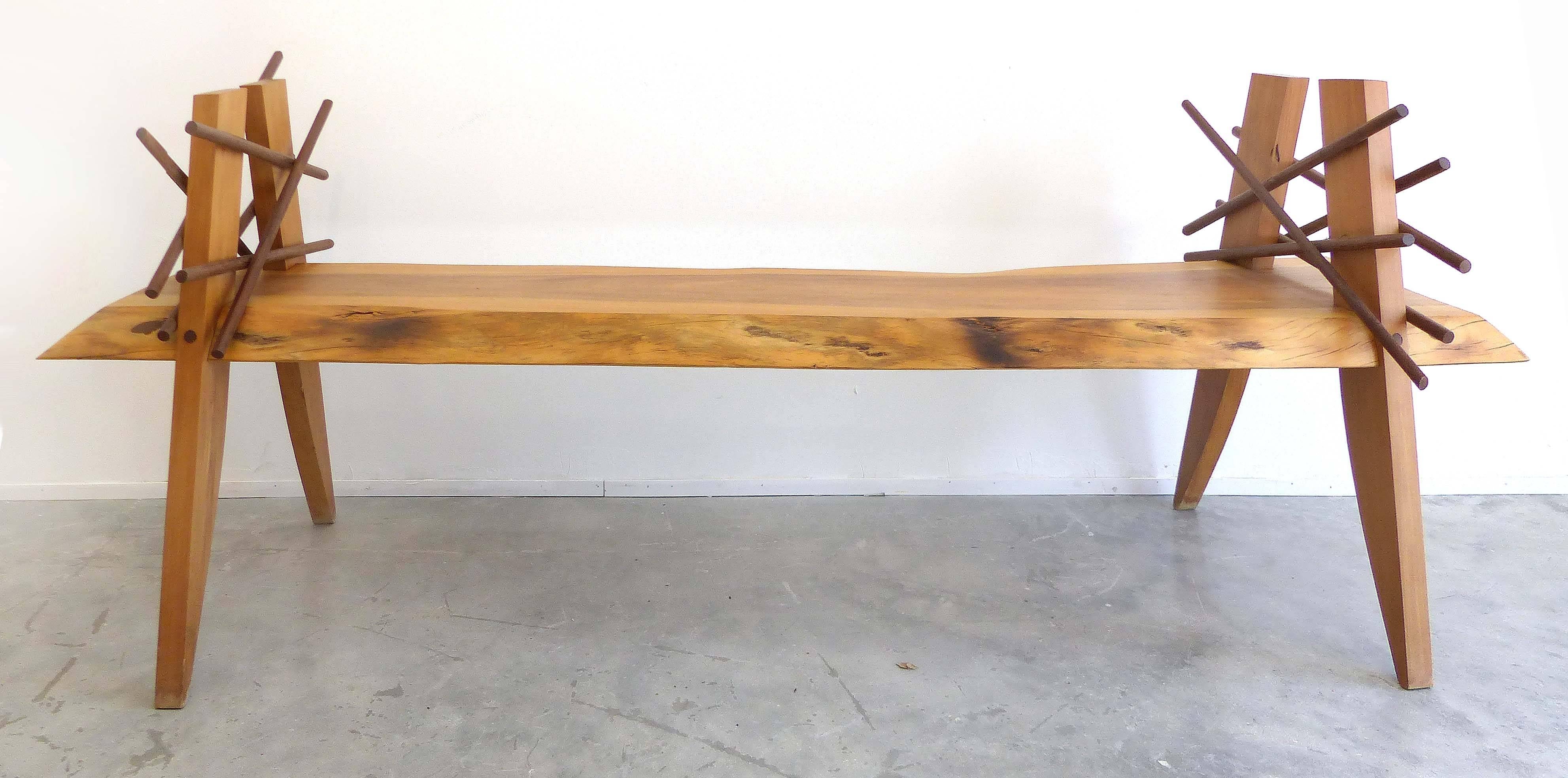 A Garapa wood bench inspired by the Xingu tribe and designed by Brazilian artist Valeria Totti. The artist has come to an agreement with the Brazilian government to aid in the replanting and reforestation of the Amazon jungle. Totti salvages fallen
