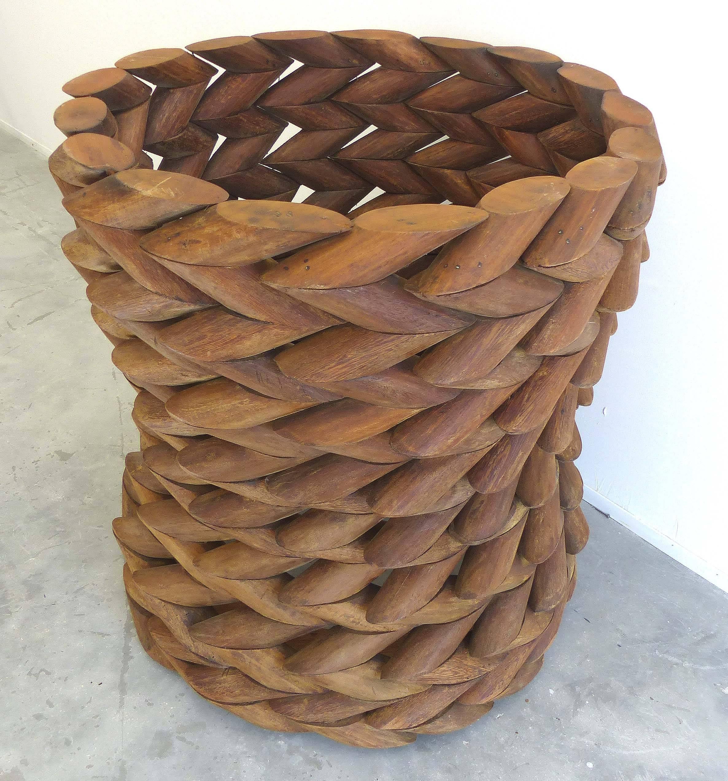 Offered is a table base of reclaimed Ipe wood from the Brazilian Amazon. Carved into an intricate chain pattern as done by the indigenous people of this area. The artist, Valéria Totti is collaborating with the Brazilian Government to protect and