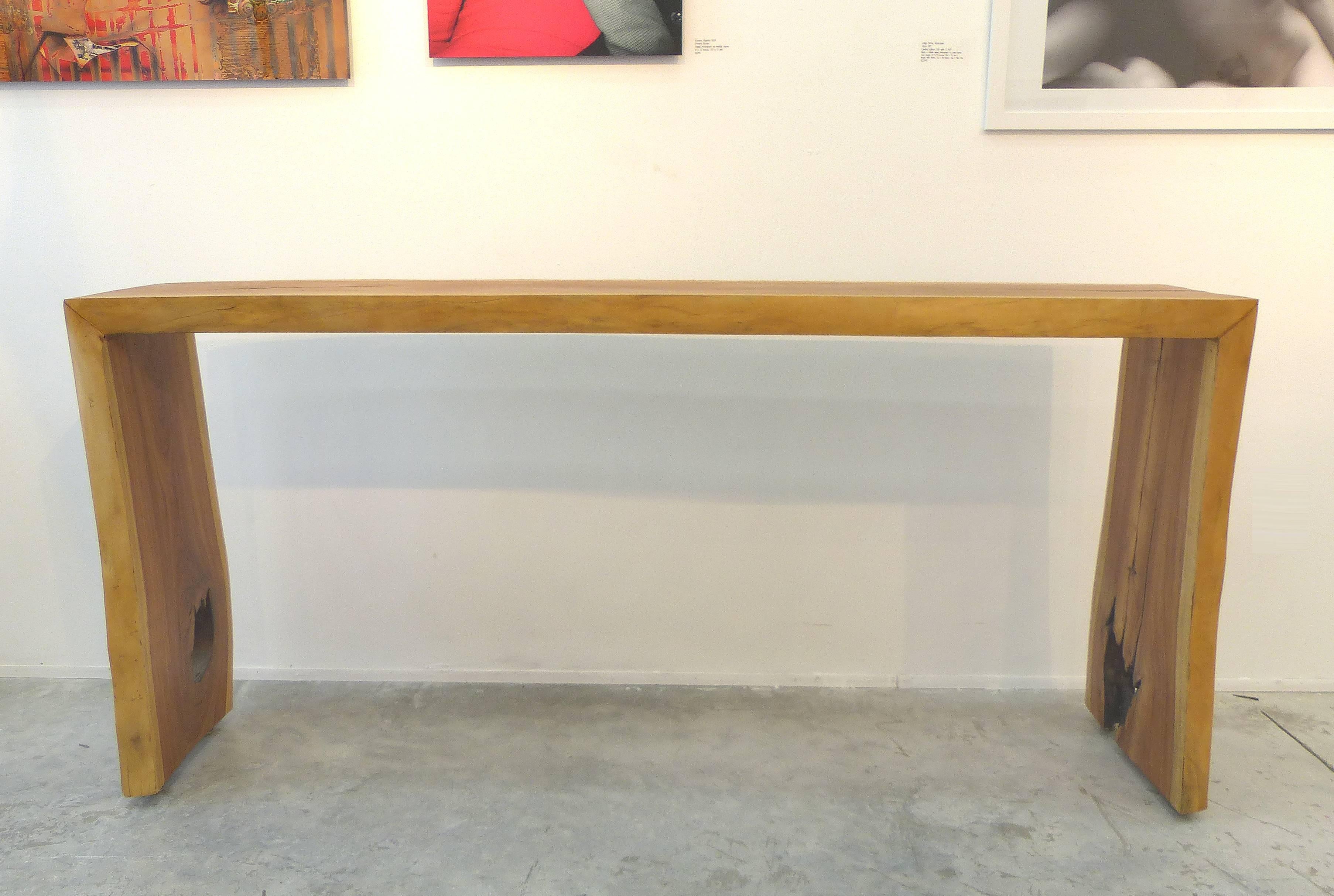 Guarapa Wood Console Table by Brazilian Contemporary Artist Valeria Totti

A beautifully grained garapa wood console table created by Brazilian artist Valeria Totti with wood salvaged from the Amazon. The beauty of this piece is in the wonderful