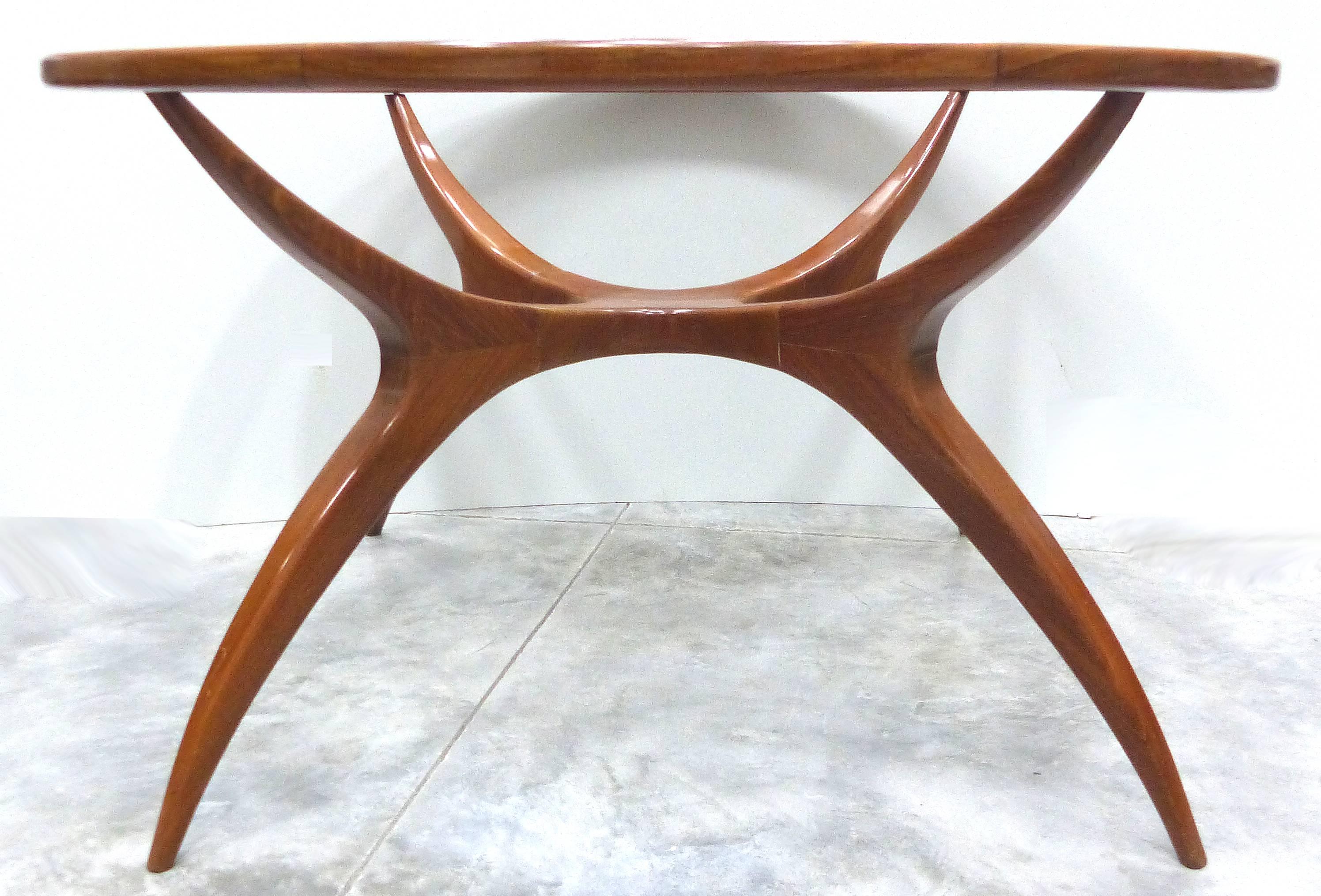 Offered is a sculptural and organic round table designed by Brazilian designer Giuseppe Scapinelli. Dating to the 1960s, the table is made of Peroba de Campos  wood. The table will serve as either a small dining table or a centre table and is fitted