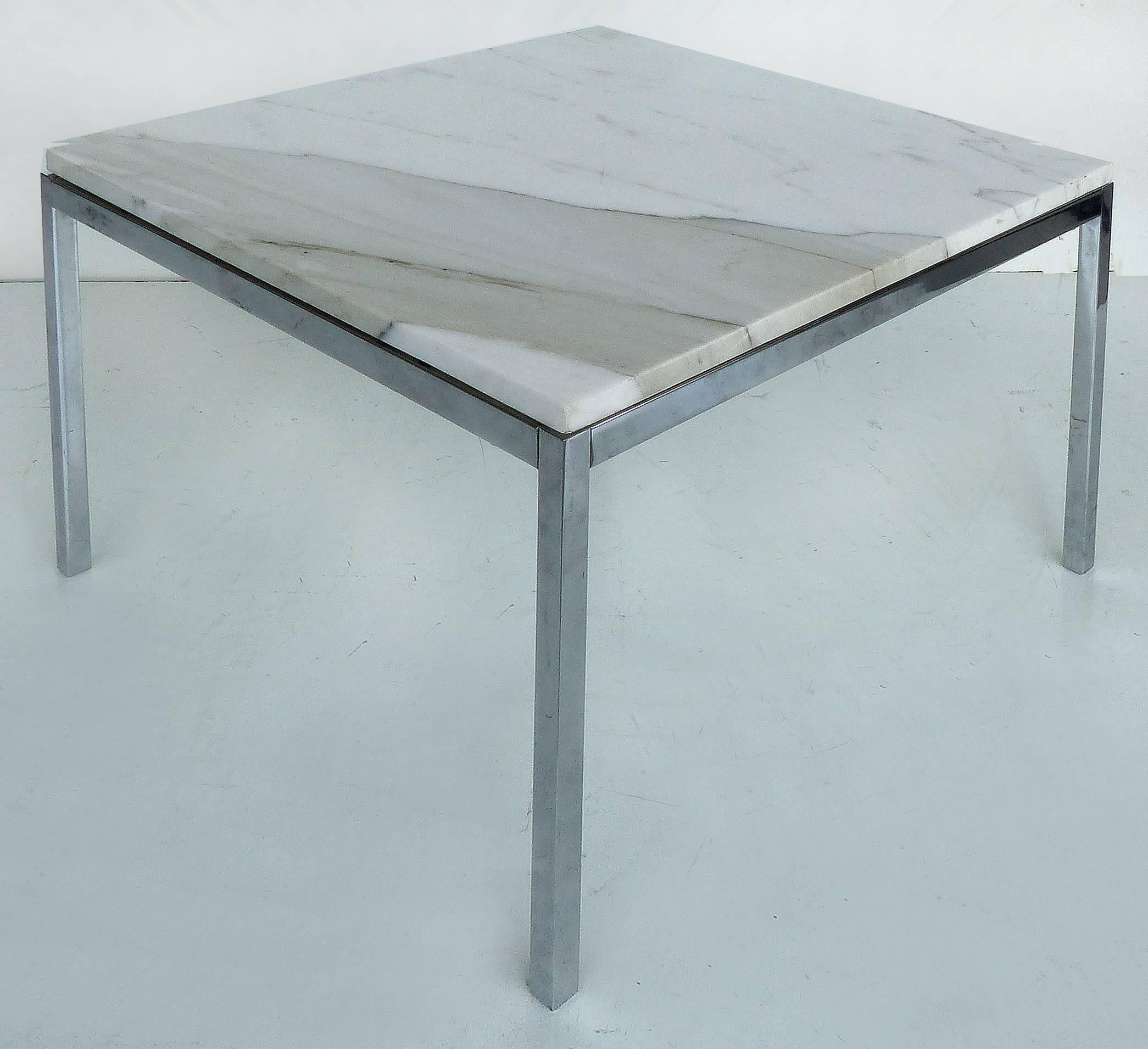 Offered is a stainless steel and calacatta marble side table stamped Knoll Studio and signed Florence Knoll on one of the legs. A simple iconic design by Knoll.