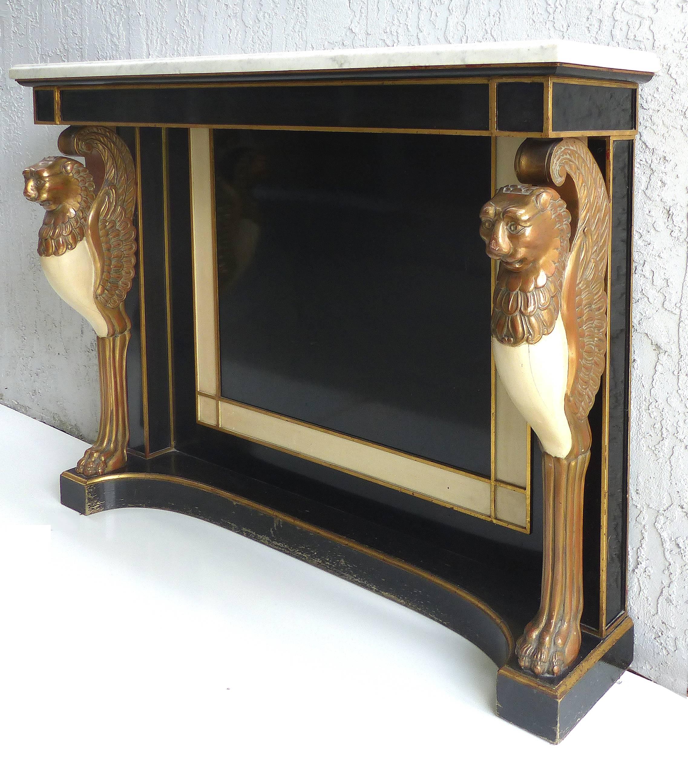 Carved Wood and Marble Empire Revival Console Table, Manner of Maison Jansen

Offered for sale is an elegant carved and lacquered wood Empire Revival console table with a marble top. The console was created, circa 1920-1930 in the manner of Maison