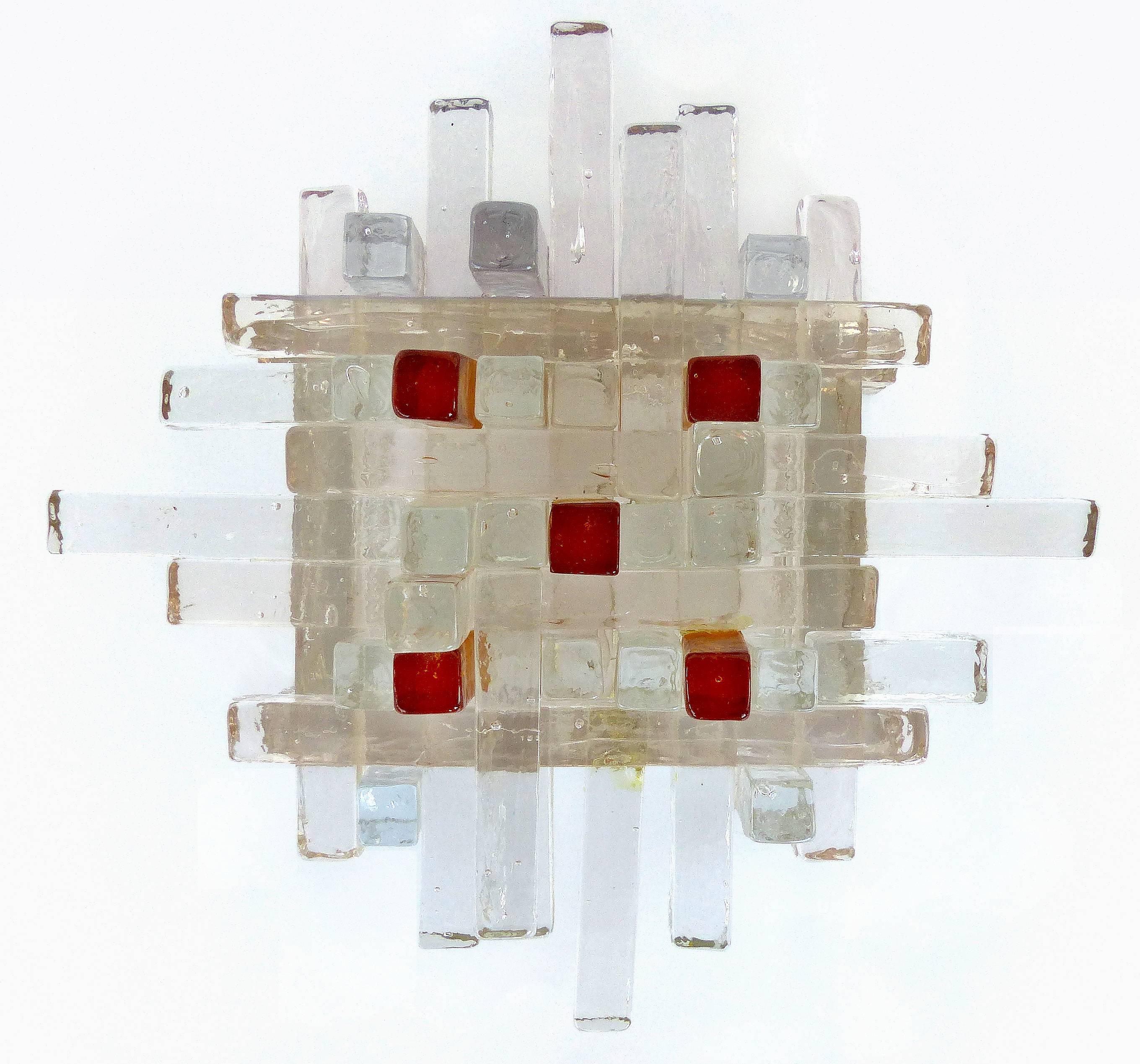 Offered for sale is a pair of Mid-century Murano glass wall sconces by Poliarte of Italy. The rectangular fused art glass rods are clear with textures to diffuse the light . Each sconce holds two standard European base sockets on a metal frame.