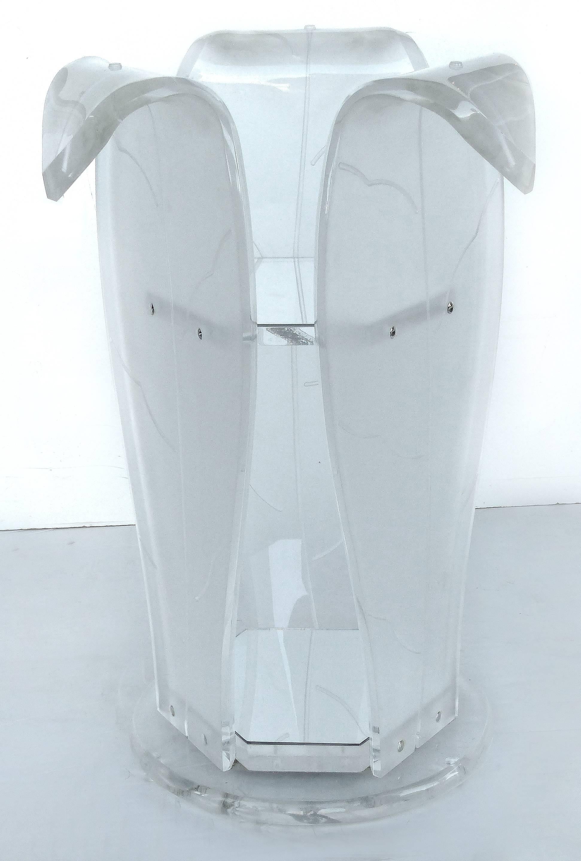 Round Lucite Pedestal Table with Glass Top

Offered for sale is a round lucite table with a pedestal base of three frosted banana leafs. The base is available separately if desired.