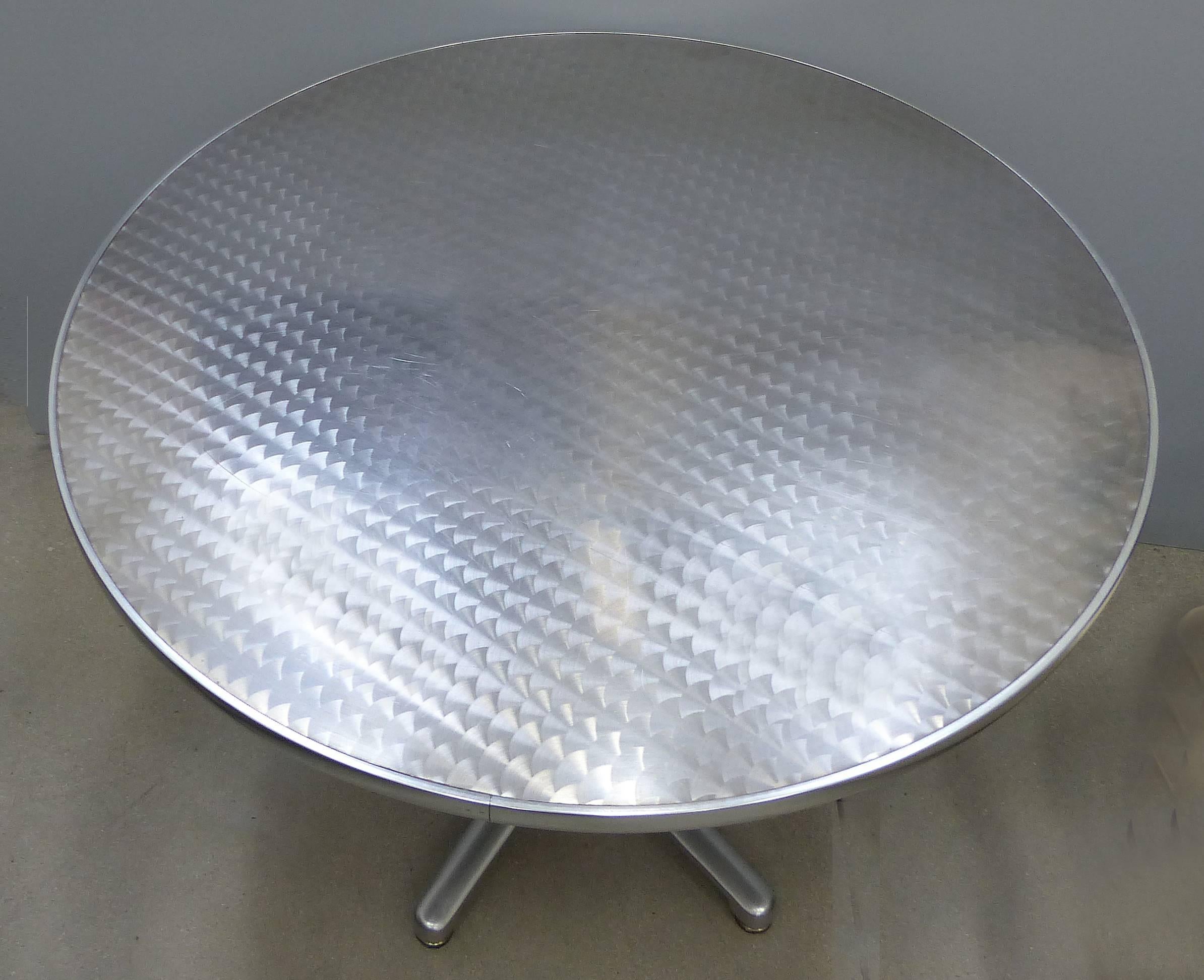 Jorge Pensi for Amat, SpainKnoll Aluminum Bistro Table

Offered for sale is a polished aluminum round bistro table with a cast aluminum base designed in 1988 by Argentinian designer Jorge Pensi from his Barcelona studio. This table was manufactured