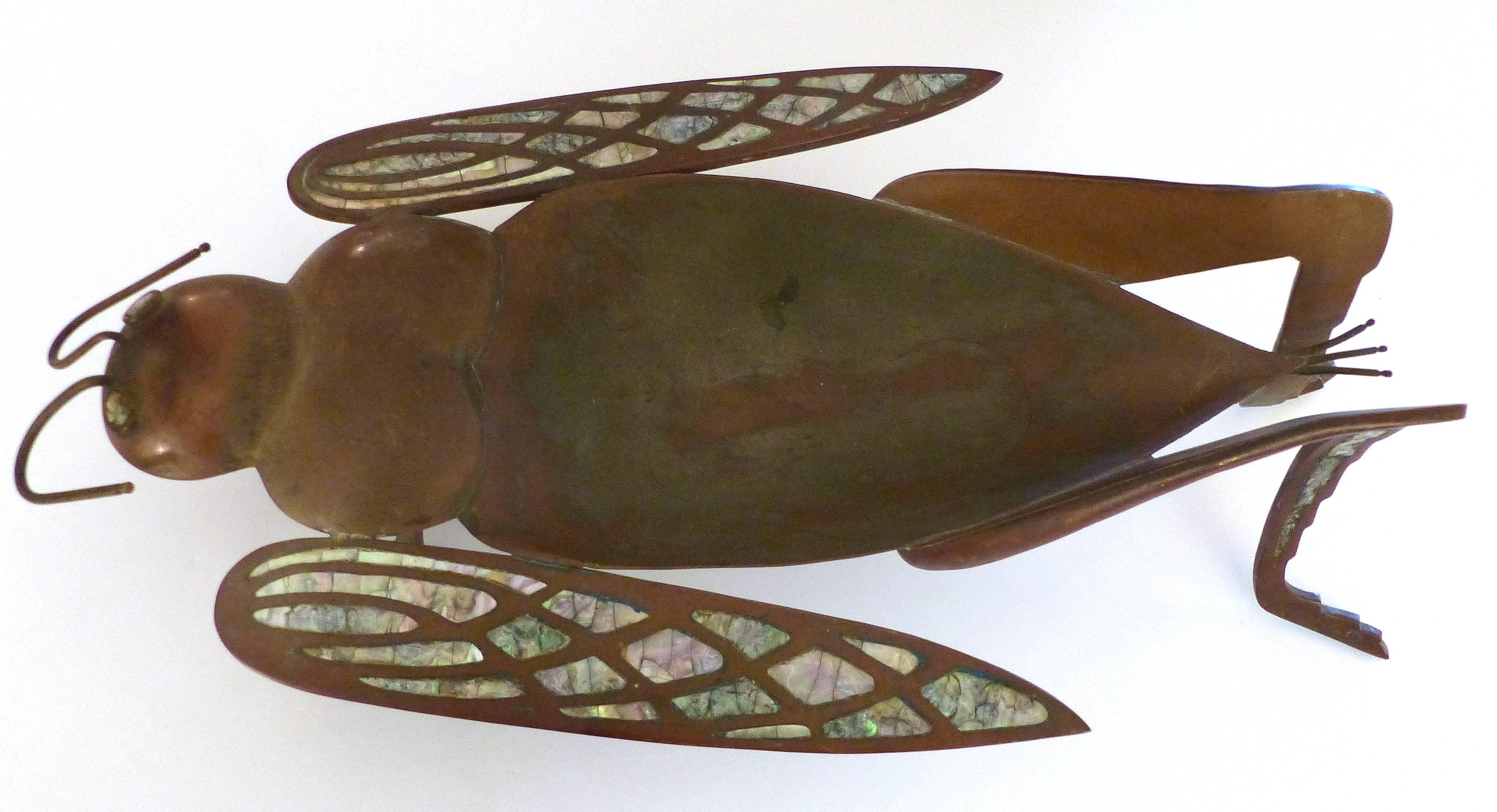 Los Castillo Brass, Copper and Abalone Dish attributed to Salvador Teran

Offered for sale is a brass, copper and abalone dish in the form of a whimsical grasshopper. Unmarked but attributed to Salvador Teran from the period when he worked in the