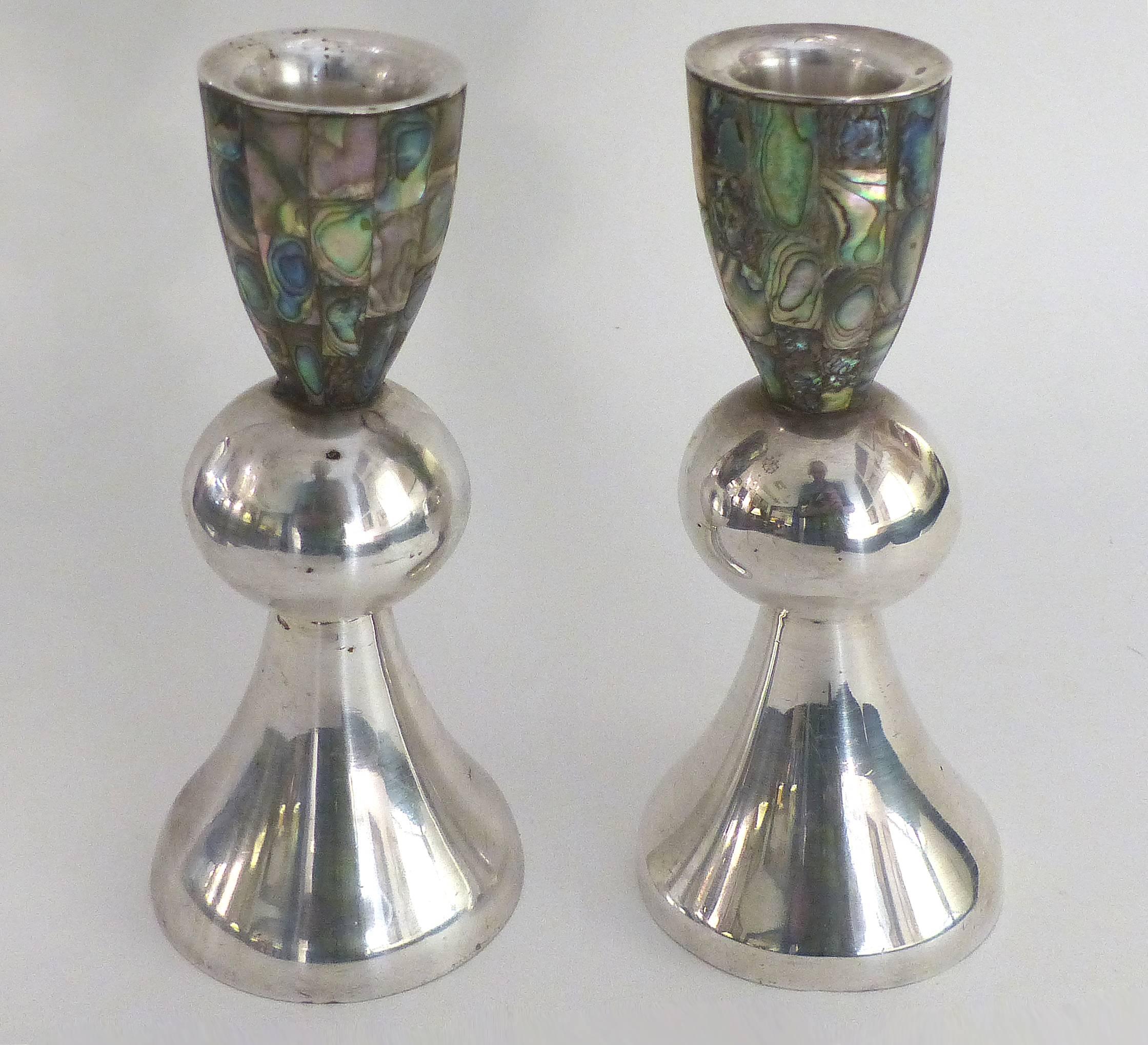 Los Castillo 'Taxco, Mexico' Silver Plate and Abalone Candleholders, Pair

Offered for sale is a pair of silver plated and abalone candlesticks from the renowned workshops of Los Castillo in Taxco, Mexico. Each candle holder is fully marked with two
