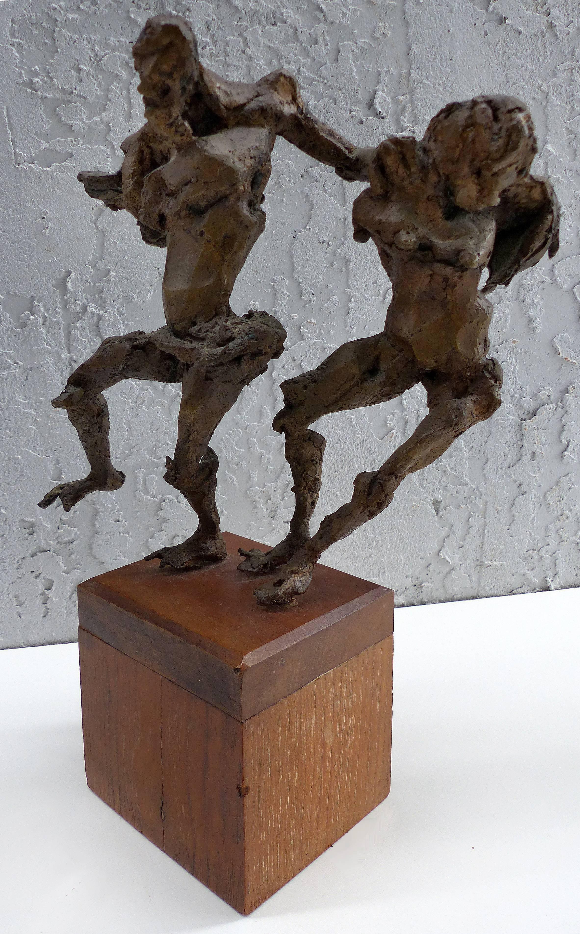 Linda Goodman Brutalist Bronze Figurative Sculpture

Offered for sale is a Brutalist bronze sculpture by the American artist Linda Goodman  (1910-2004). This Mid-Century Modern bronze sculpture depicts two frolicking figures supported upon a wooden