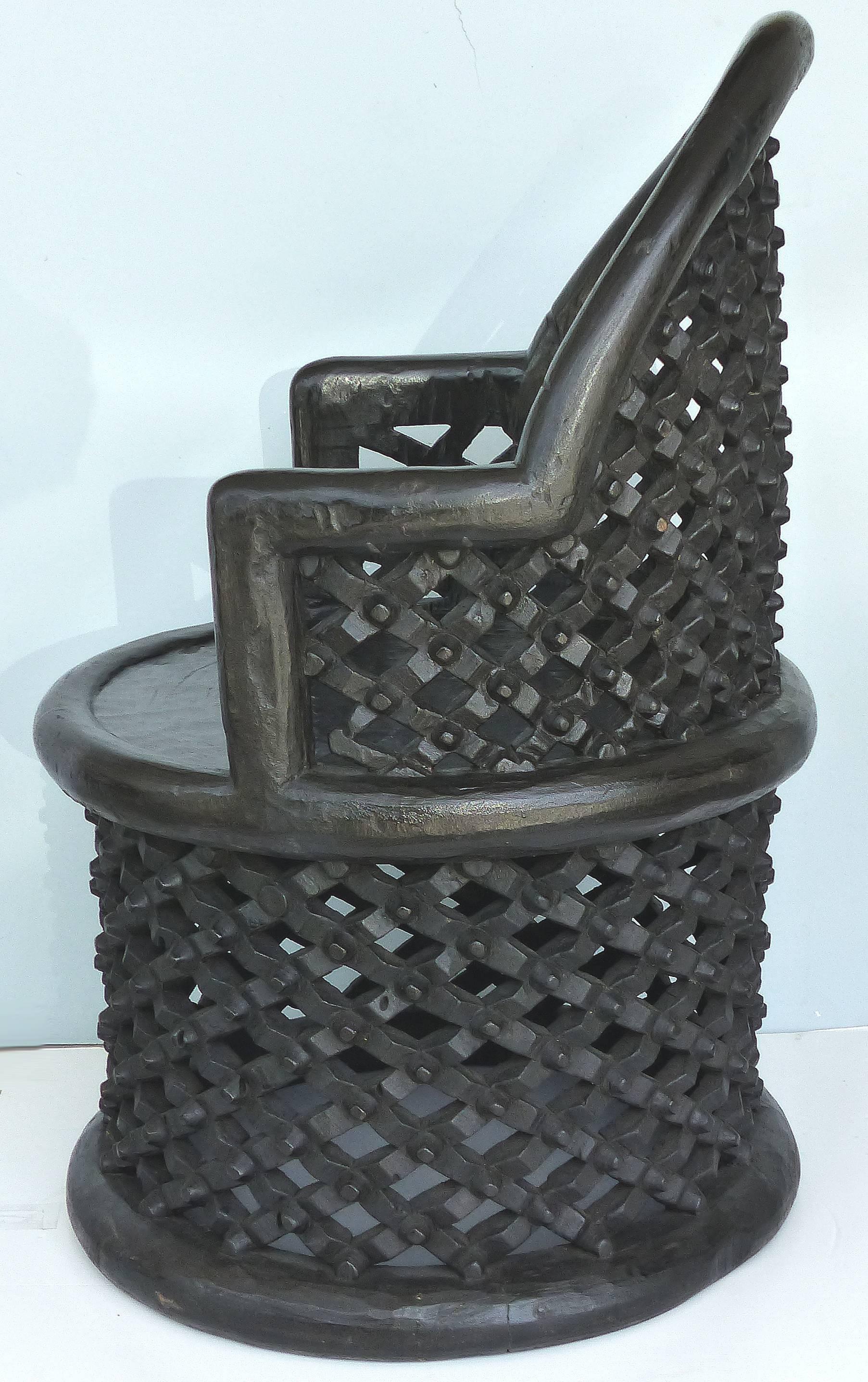 Carved Spider Chair from the Bamileke Tribe of Cameroon

Offered for sale is a SINGLE hand-carved chair from the Bamileke Tribe of Cameroon. This 20th-century chair each carved from a single tree trunk as the earlier Bamileke tribes have. The chair