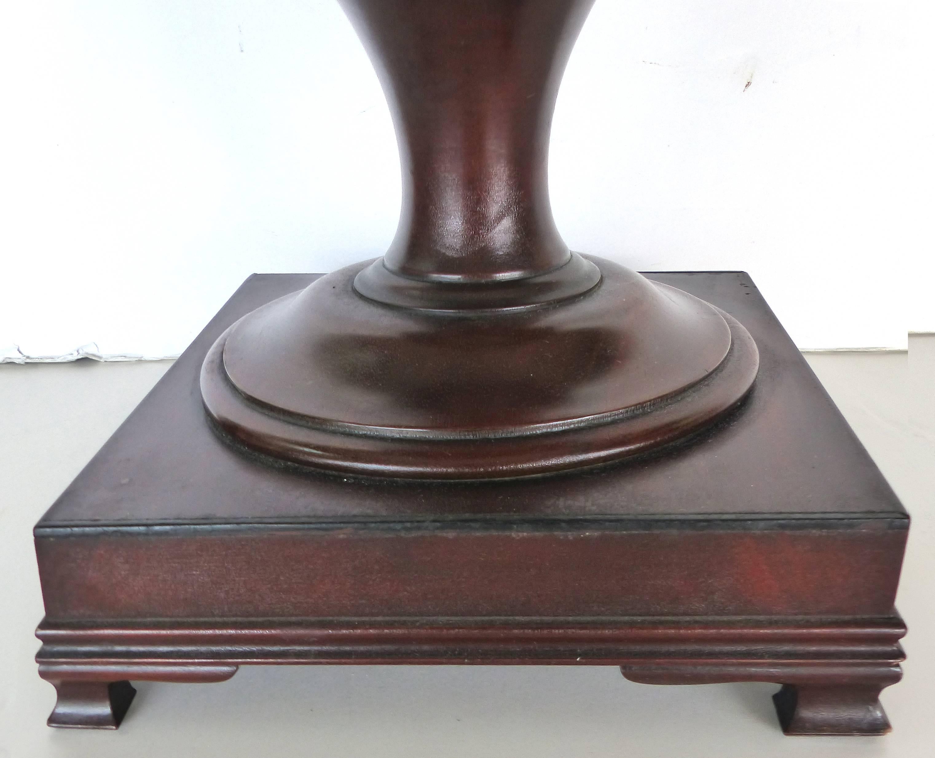 
A pair of circa 1940s mahogany urn form knife boxes with rising finial lids. Each box offers various shape inserts to accommodate cutlery of all types. Created after the Classic 18th century Federal urn form boxes with a rich patina from age. Base