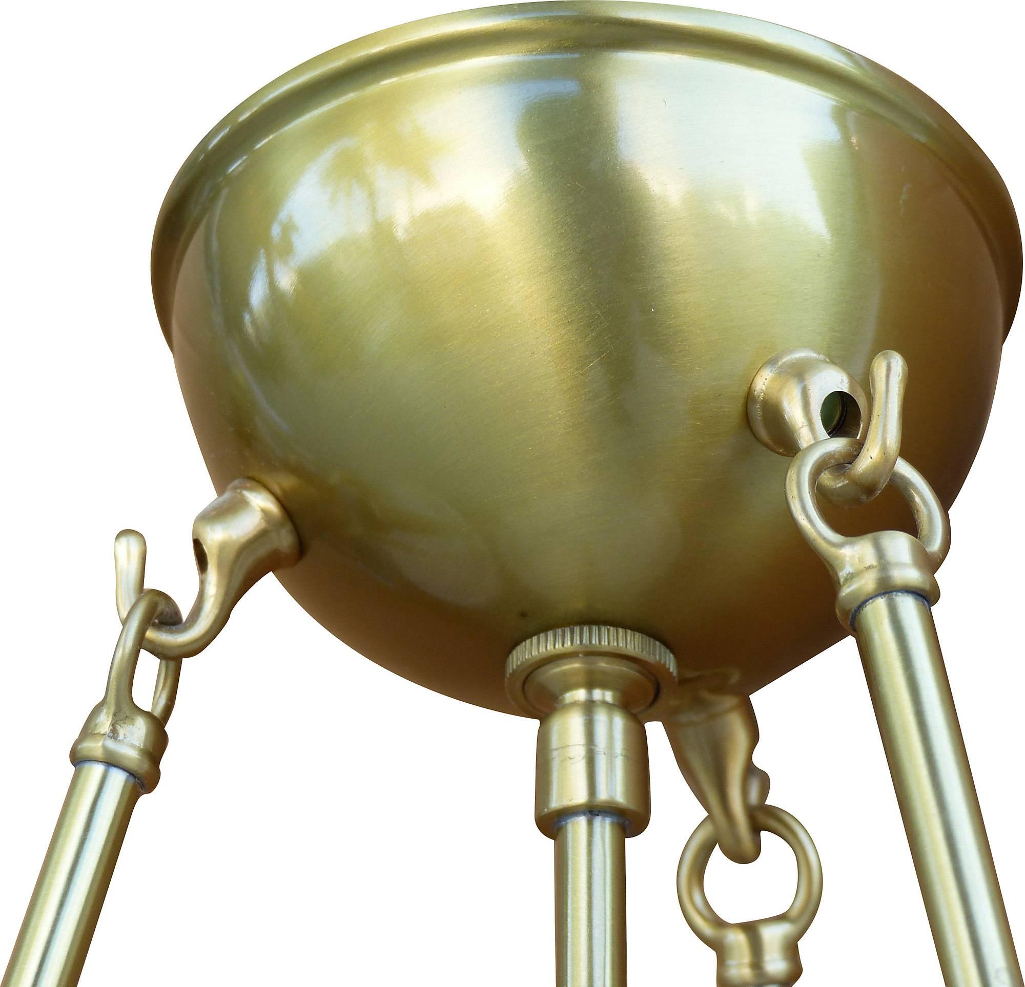 

Pair of dome shade alabaster chandeliers marked Nessen Lighting suspended by three brass rods with an additional center rod providing the light source. The alabaster has gray accent veins. The rods rise to a brass domed ceiling canopy. Wired and