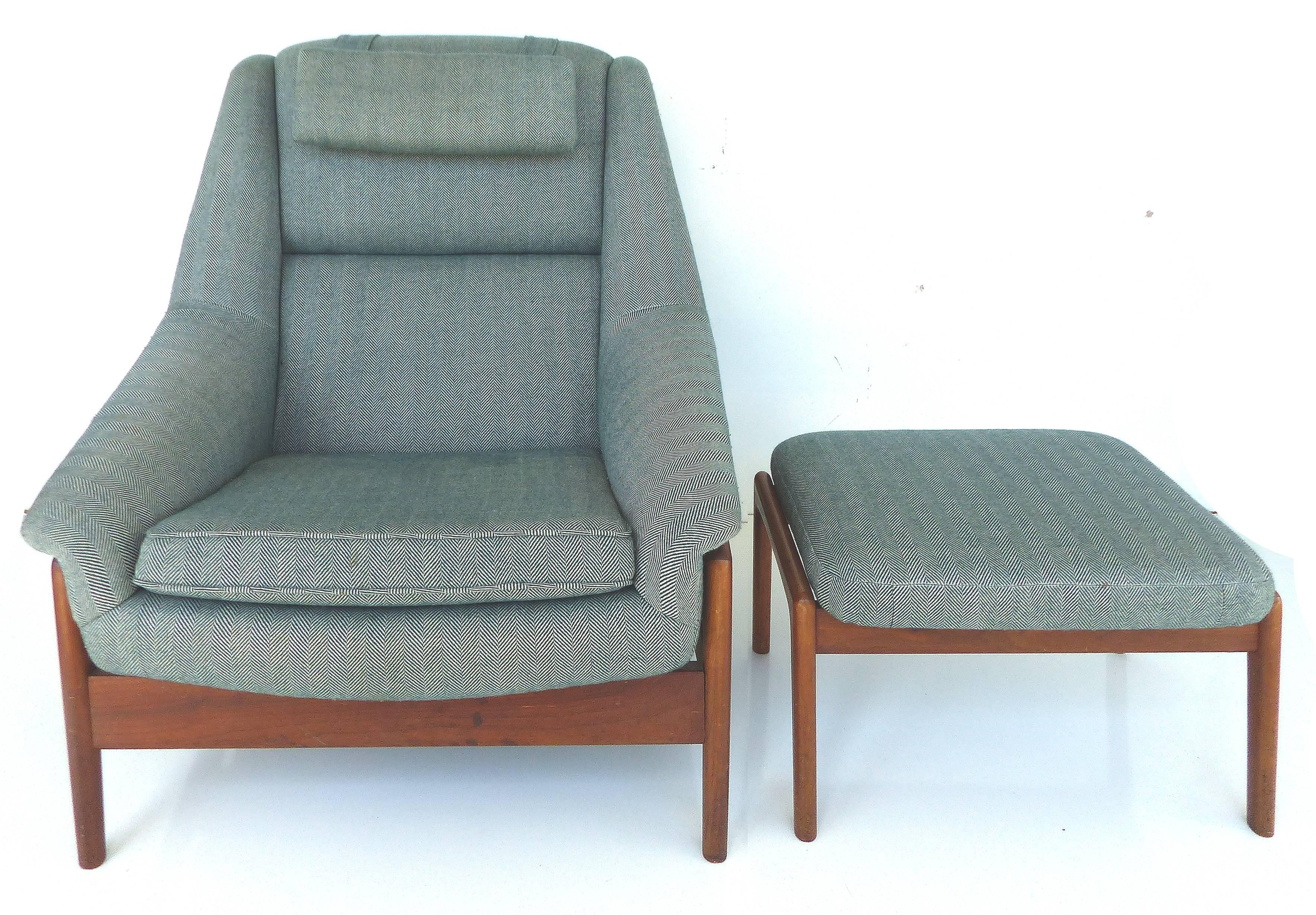 A Scandinavian reclining lounge chair and ottoman by DUX. The chair can be adjusted back in a reclining position and the ottoman is also adjustable. The pair are upholstered in a soft herringbone pattern. Removable headrest pillow drapes over the