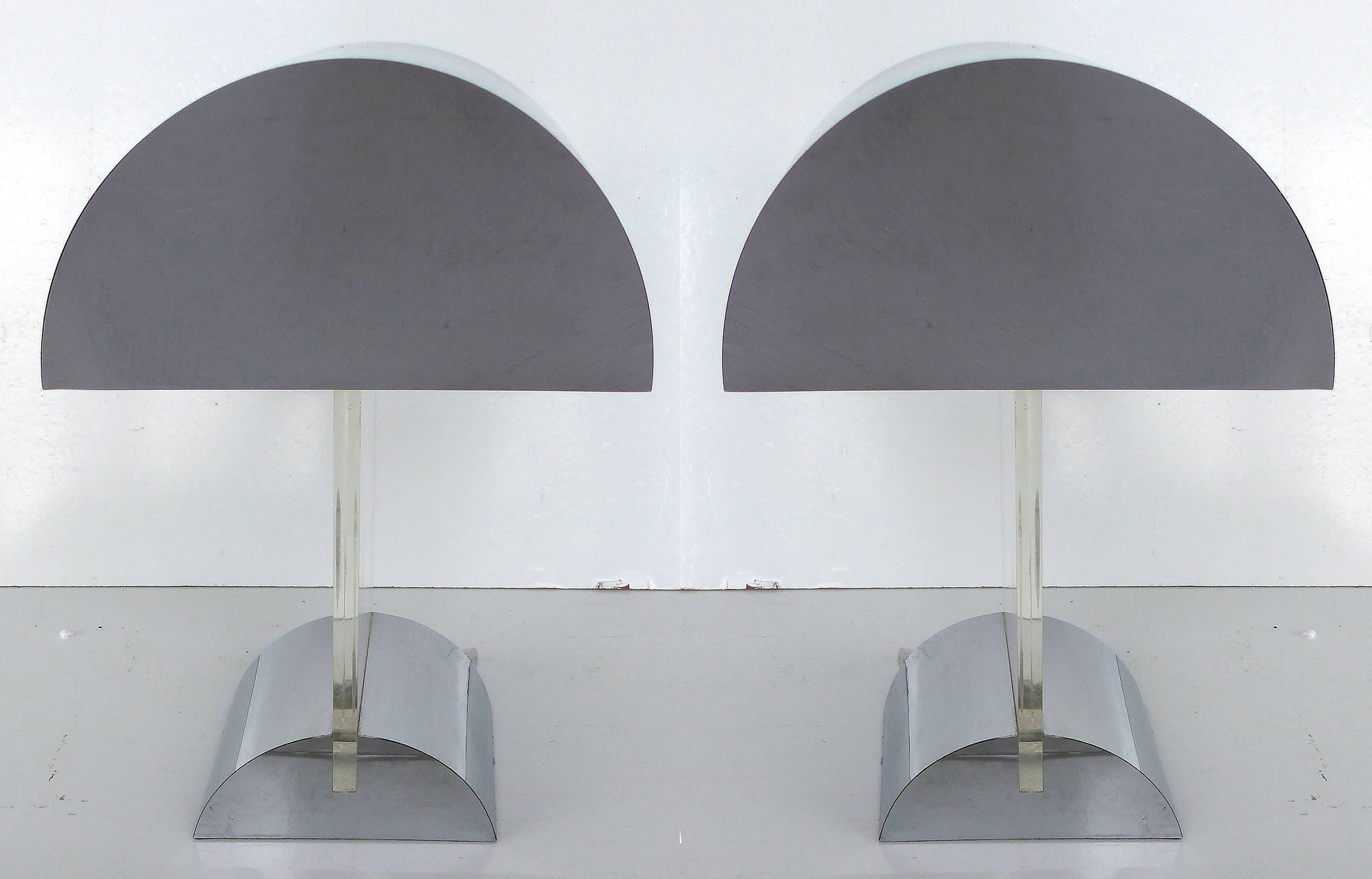 A pair of Mid-Century Modern curved dome top table lamps with matching bases and Lucite supports attributed to George Kovacs. The domes are clad in polished chrome metal which accents the thick Lucite center slabs. Wired and in working condition;