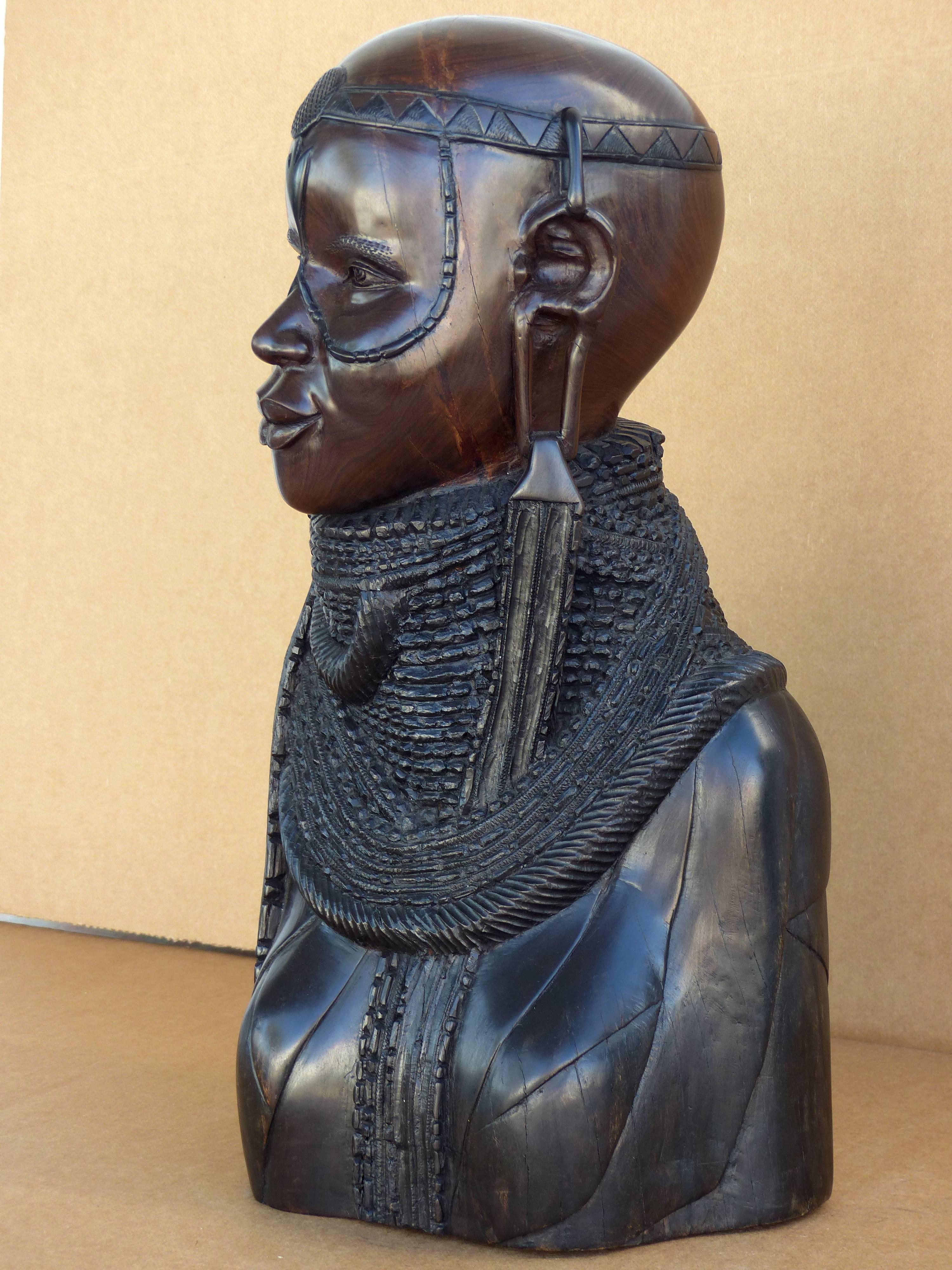 20th Century Large Finely Carved African Solid Ebony Sculpture

A finely carved and detailed solid ebony sculpture of an African tribal woman. So realistic that the expression is captivating. Carved from a solid block of ebony. A large and heavy