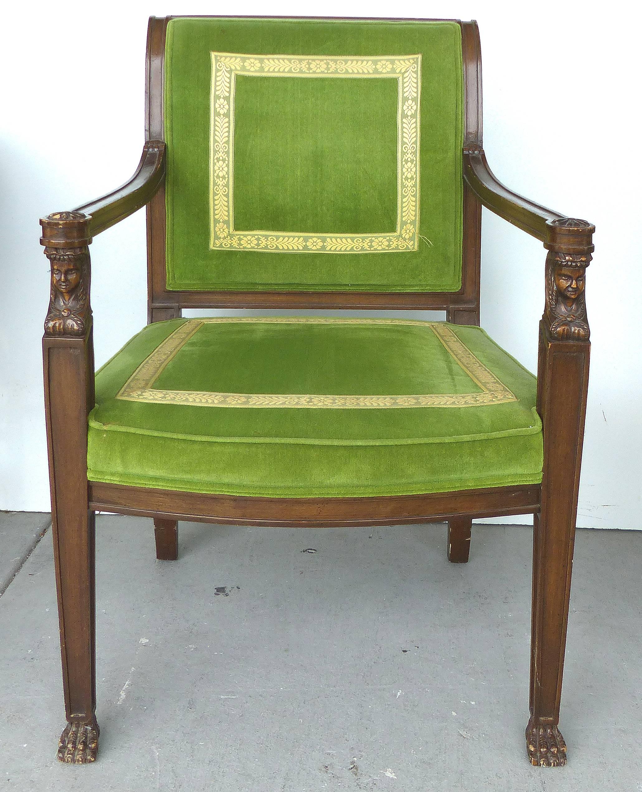 A pair of formal carved Renaissance style armchairs upholstered in velvet with tapestry ribbon trim. Original labels beneath the seats for Cocheo Brothers; Fine furniture manufacturers for clients such as Billy Baldwin and Marshal Fields. Measures: