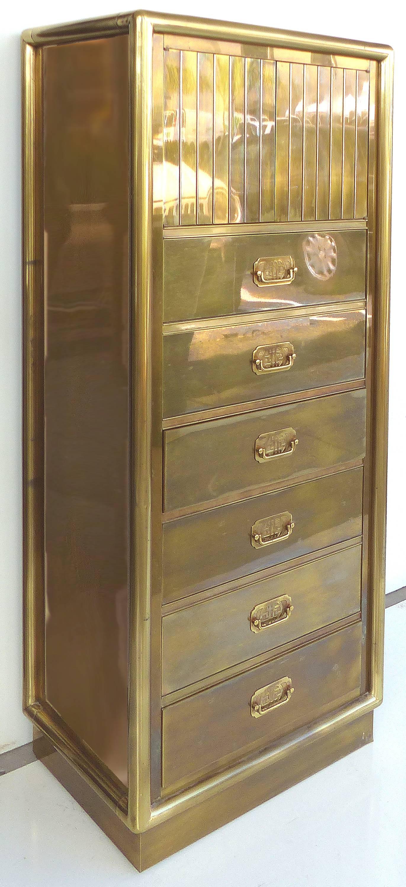 A rare fine quality brass lingerie chest from Mastercraft with six drawers below and two latch release doors above. The two upper doors open to reveal three lined drawers with sectioned compartments. The lower drawers have Asian motif hardware. The