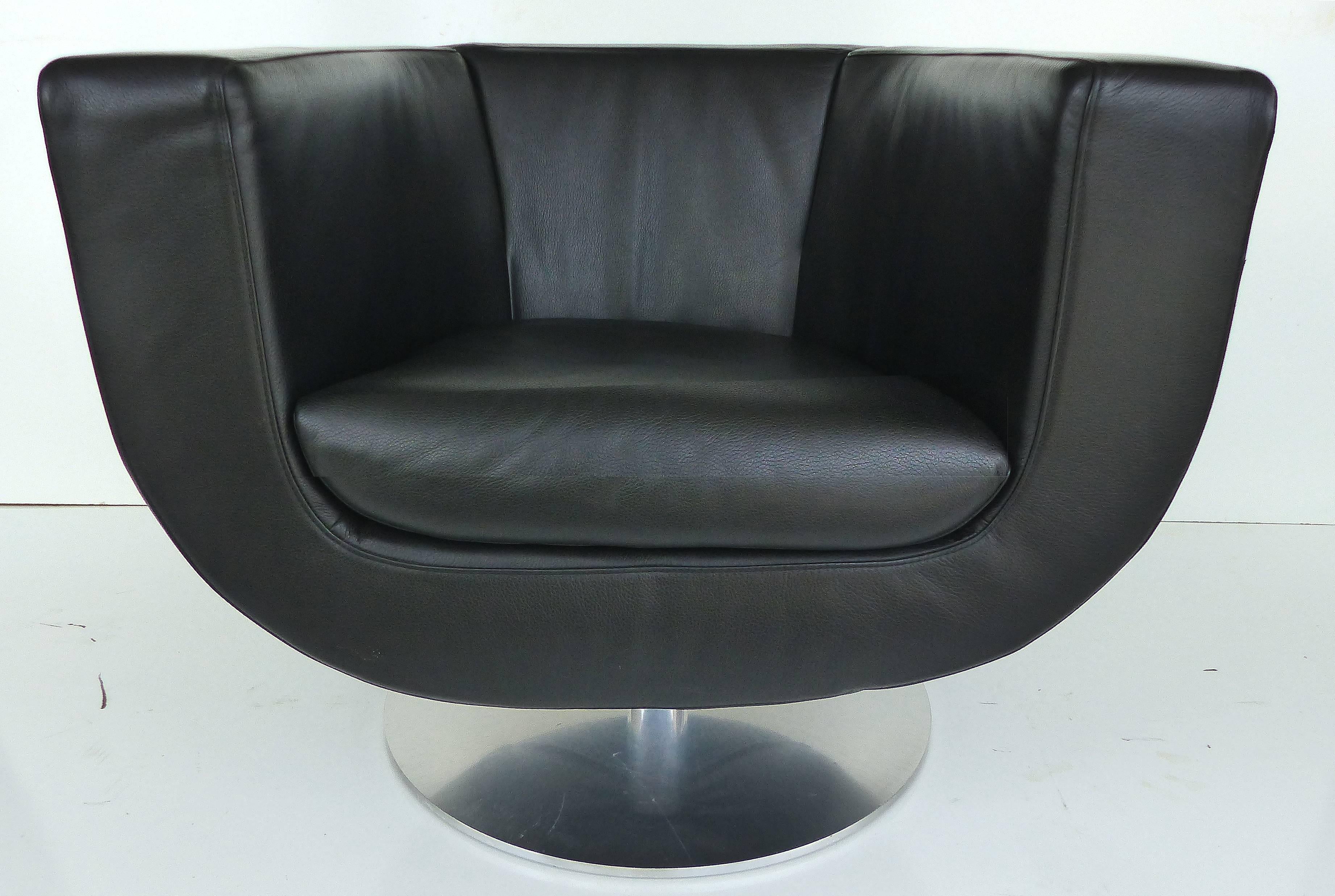 Jeffery Bernett B&B Italia Leather Tulip Swivel Chairs,Early 21st Century, Pair

A pair of fine quality black Tulip swivel chairs by Jeffery Bernett for B&B Italia. These chairs are marked beneath the removable seat cushions. The bases show some