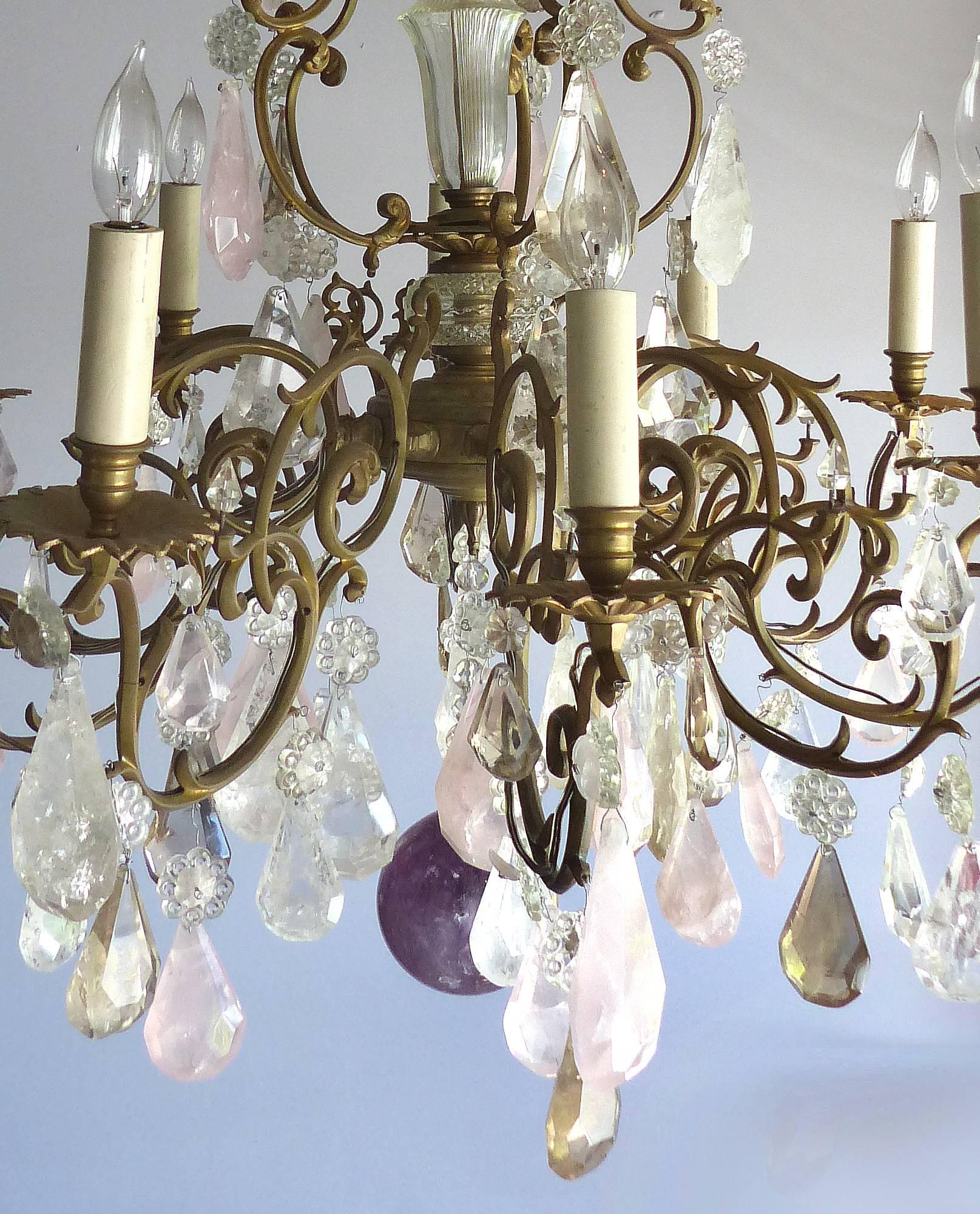 19th Century French Amethyst Quartz, Rock Crystal and Rose Quart Chandelier

Offered is a French 19th century bronze ormolu chandelier with later French wired electrification. Adorned with large amethyst quartz, clear rock crystals, amber quartz and