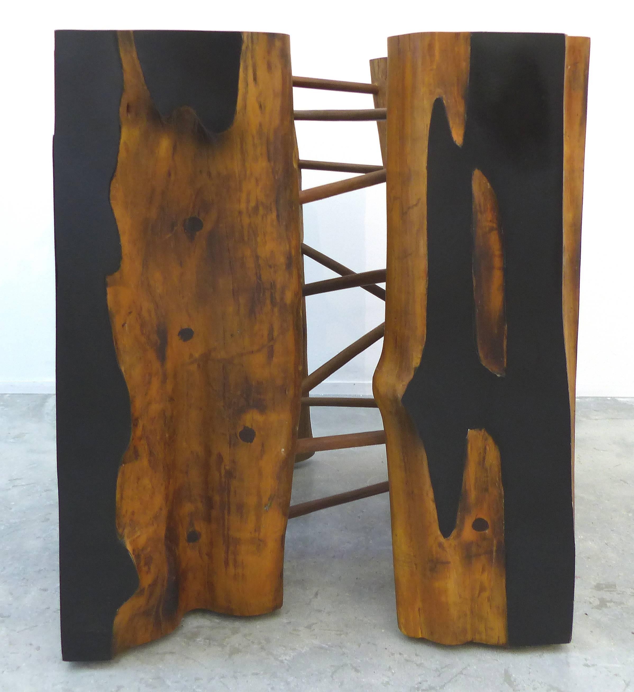 Brazilian Reclaimed Amazon Guaranta Wood Table Base by Artist Valeria Totti

Offered is a Brazilian Guaranta wood table base by Valeria Totti. The artist has embellished this found piece of wood from the Amazon by adding wood dowels and painting the